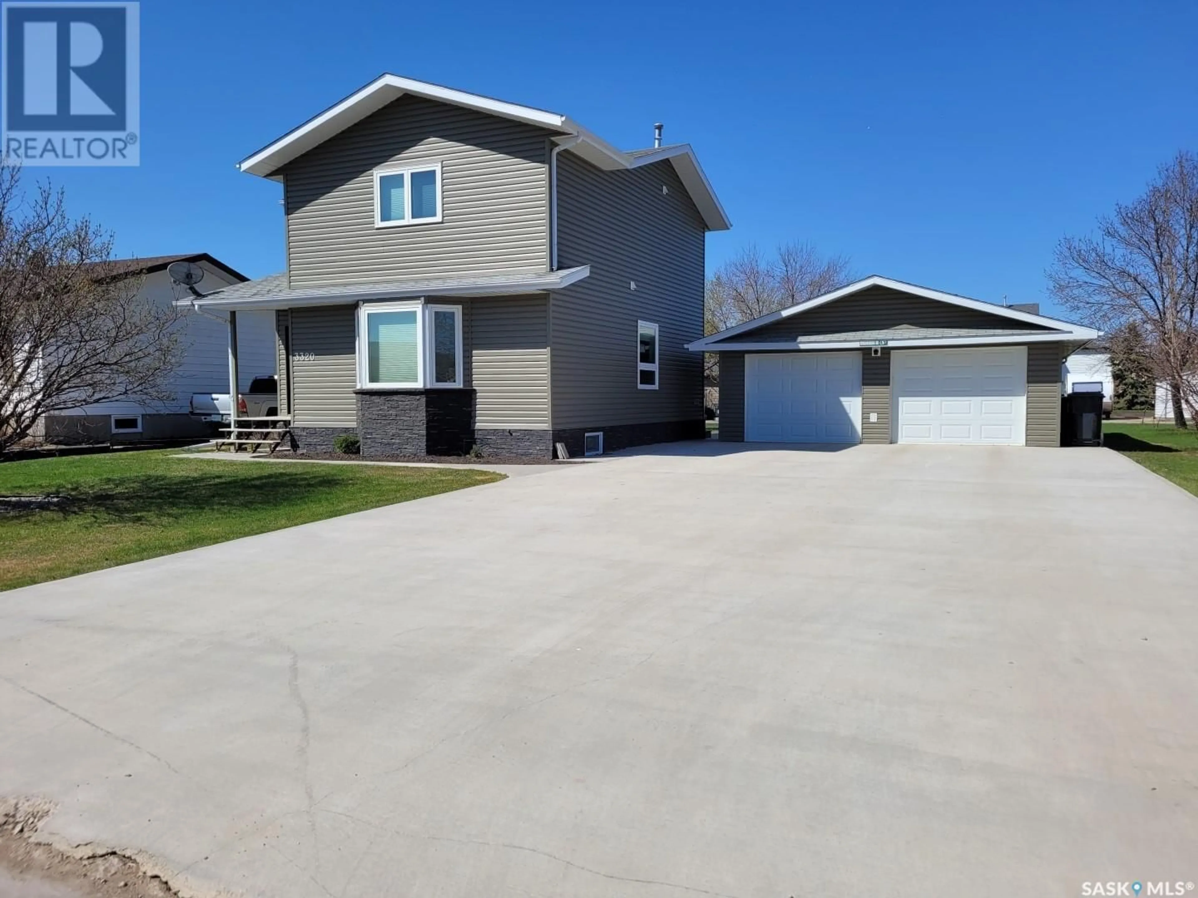 Home with vinyl exterior material, street for 3320 3RD STREET, Carrot River Saskatchewan S0E0L0