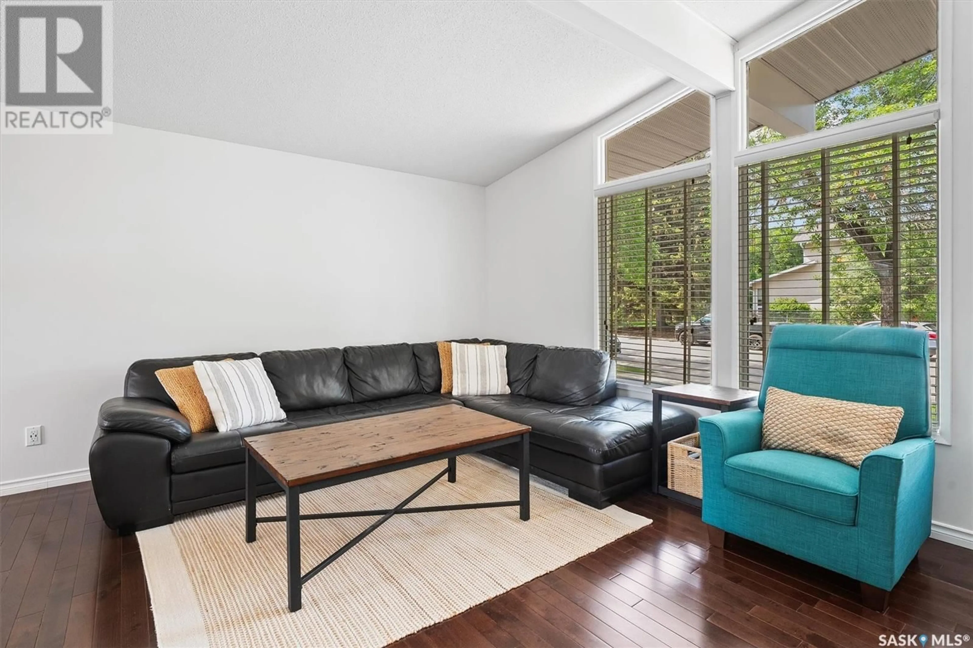 Living room with furniture, wood/laminate floor for 10 CAMBRIDGE CRESCENT, Saskatoon Saskatchewan S7H3P8