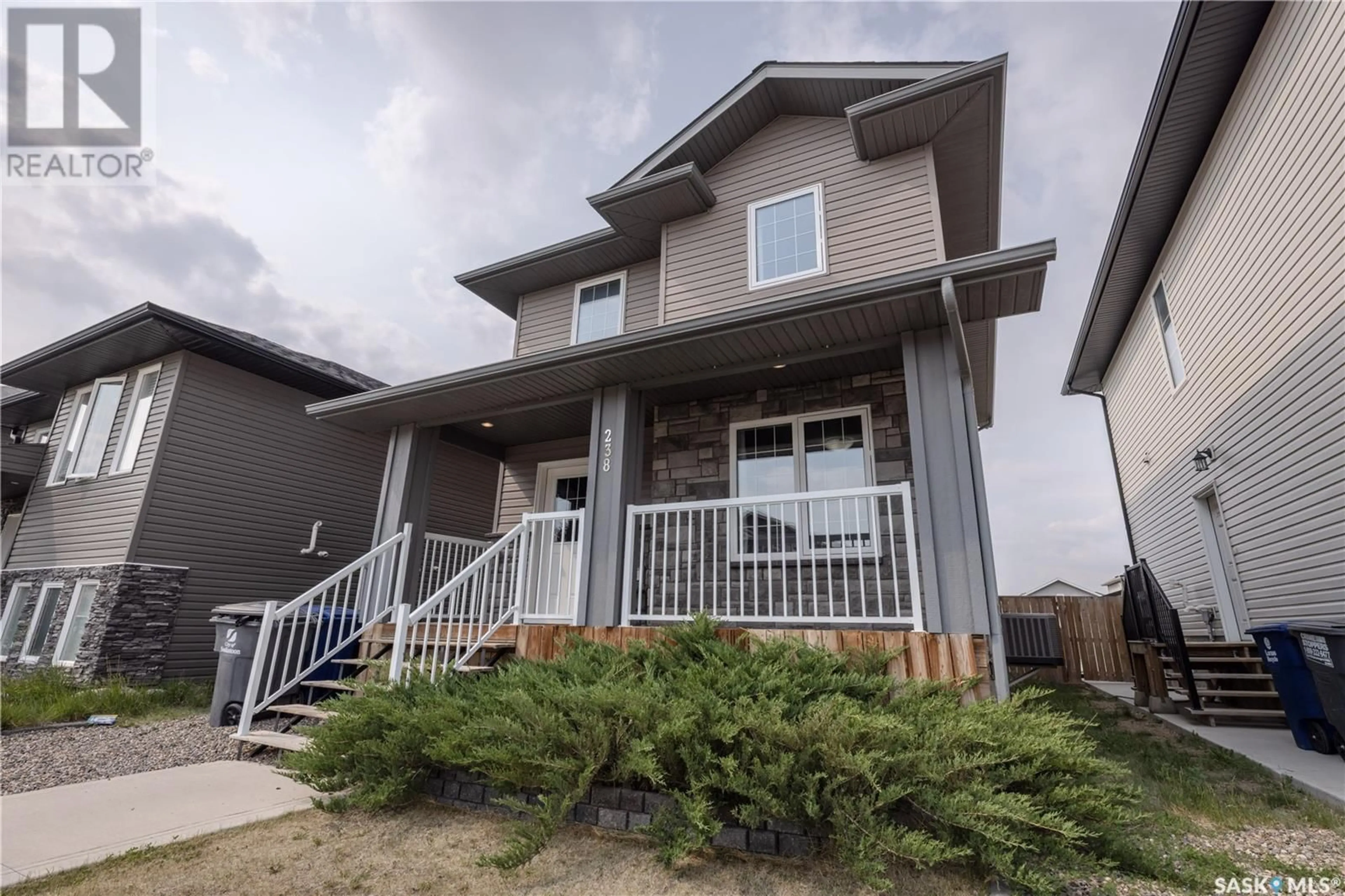 Home with vinyl exterior material, street for 238 KLOPPENBURG WAY, Saskatoon Saskatchewan S7W0N6