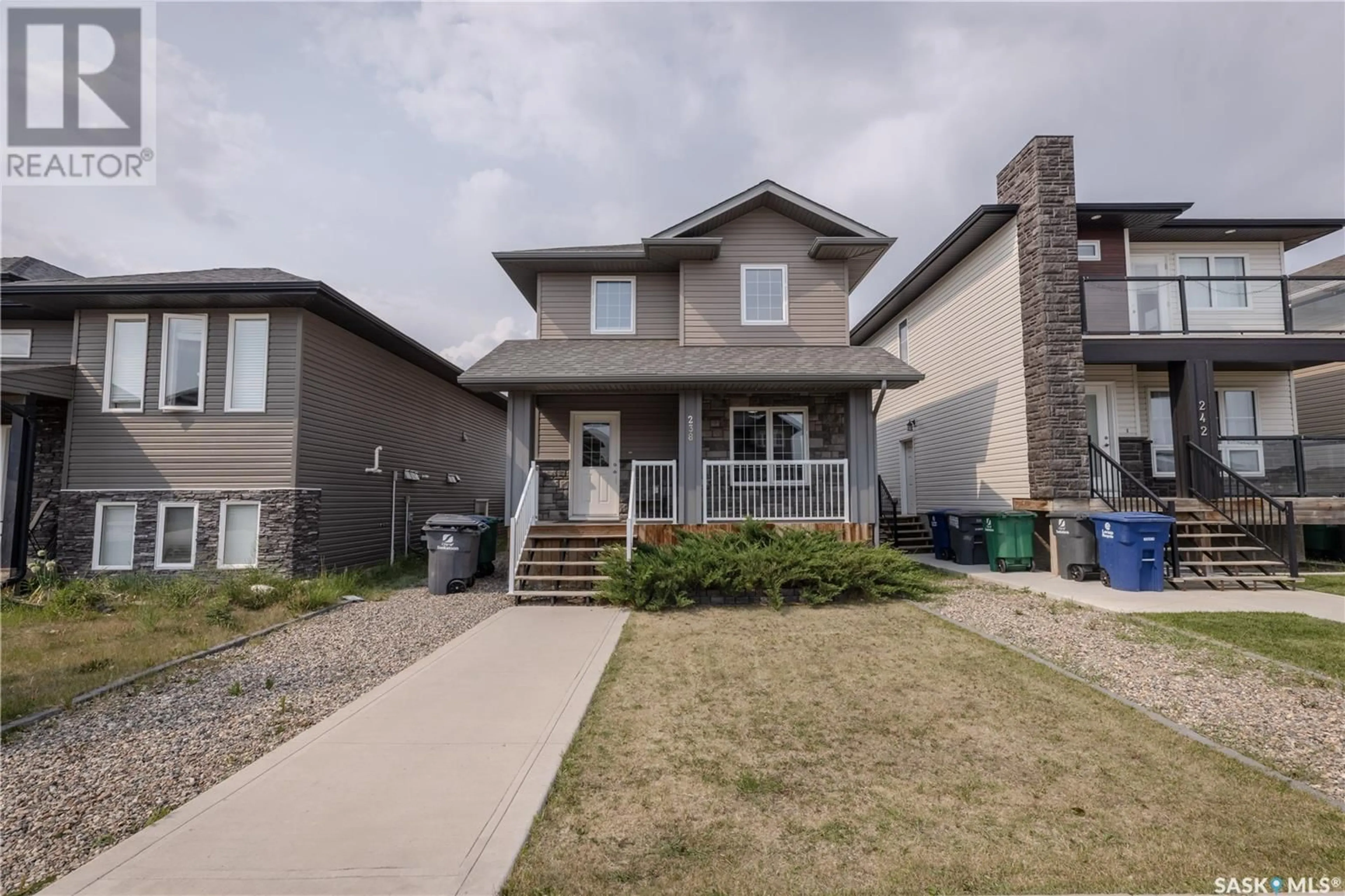 Home with vinyl exterior material, street for 238 KLOPPENBURG WAY, Saskatoon Saskatchewan S7W0N6
