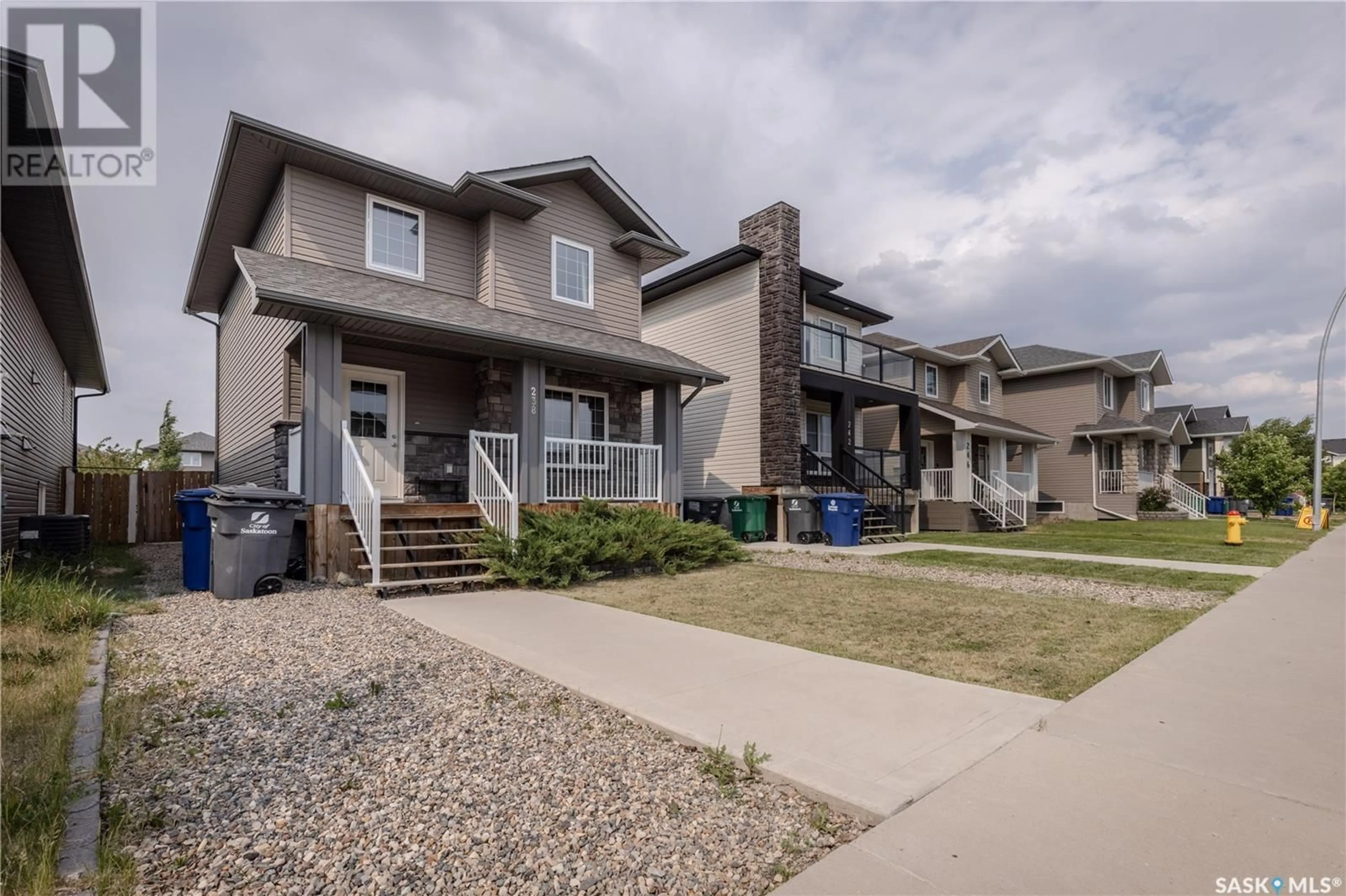 Home with vinyl exterior material, street for 238 KLOPPENBURG WAY, Saskatoon Saskatchewan S7W0N6