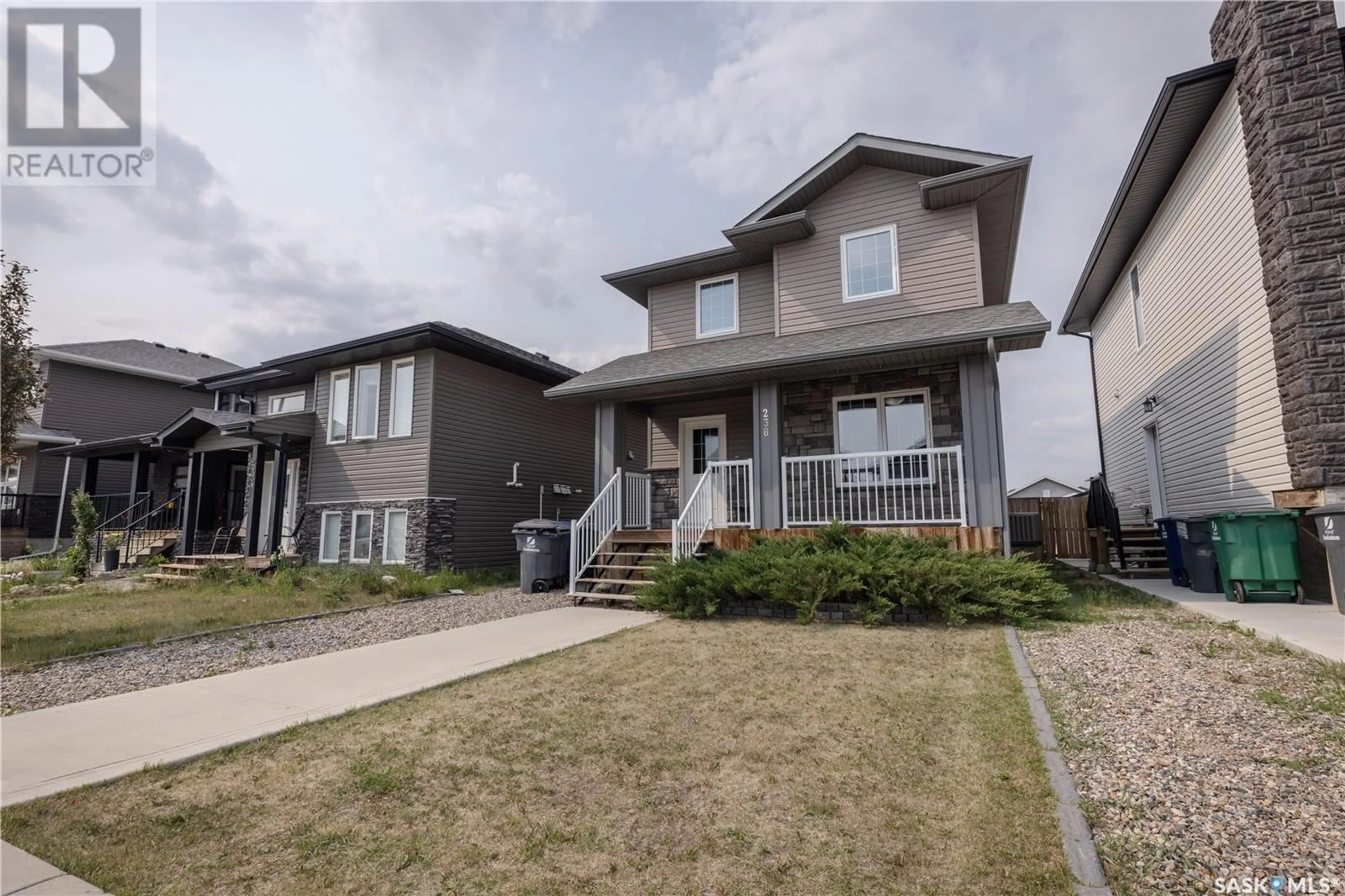 Home with vinyl exterior material, street for 238 KLOPPENBURG WAY, Saskatoon Saskatchewan S7W0N6