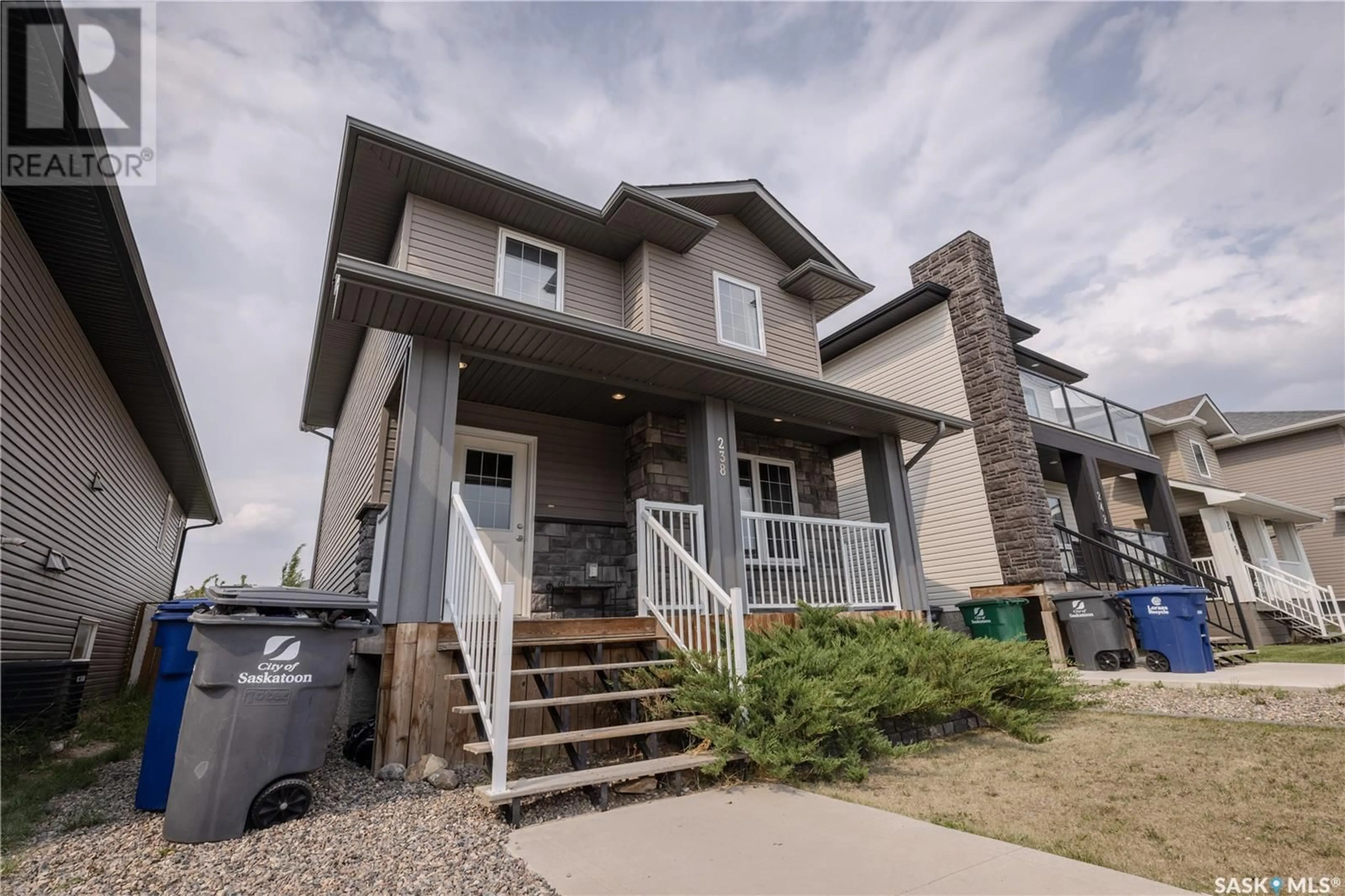 Home with vinyl exterior material, street for 238 KLOPPENBURG WAY, Saskatoon Saskatchewan S7W0N6