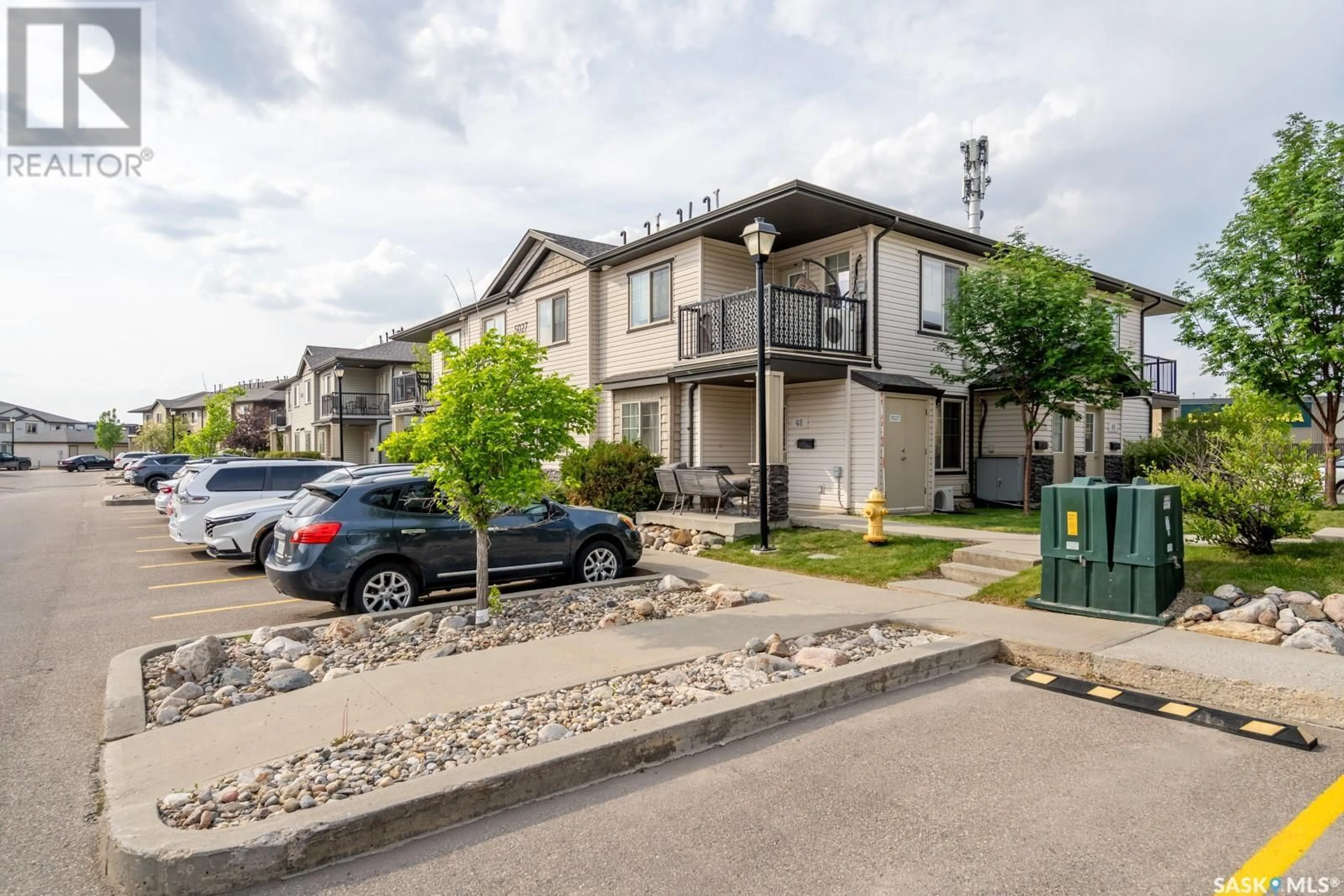 A pic from outside/outdoor area/front of a property/back of a property/a pic from drone, street for 46 - 5027 JAMES HILL ROAD, Regina Saskatchewan S4W0B9