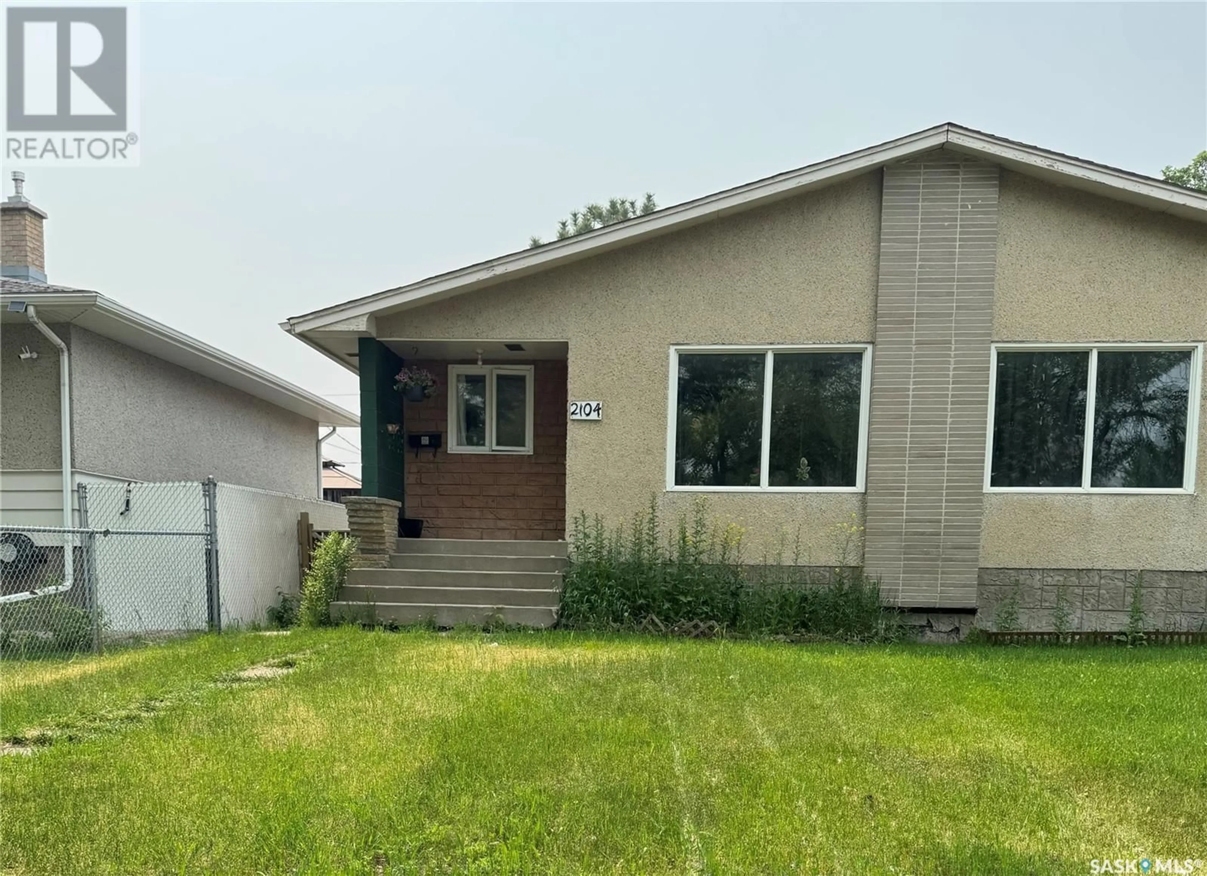 Home with vinyl exterior material, unknown for 2102-2104 ROTHWELL STREET, Regina Saskatchewan S4N2C4