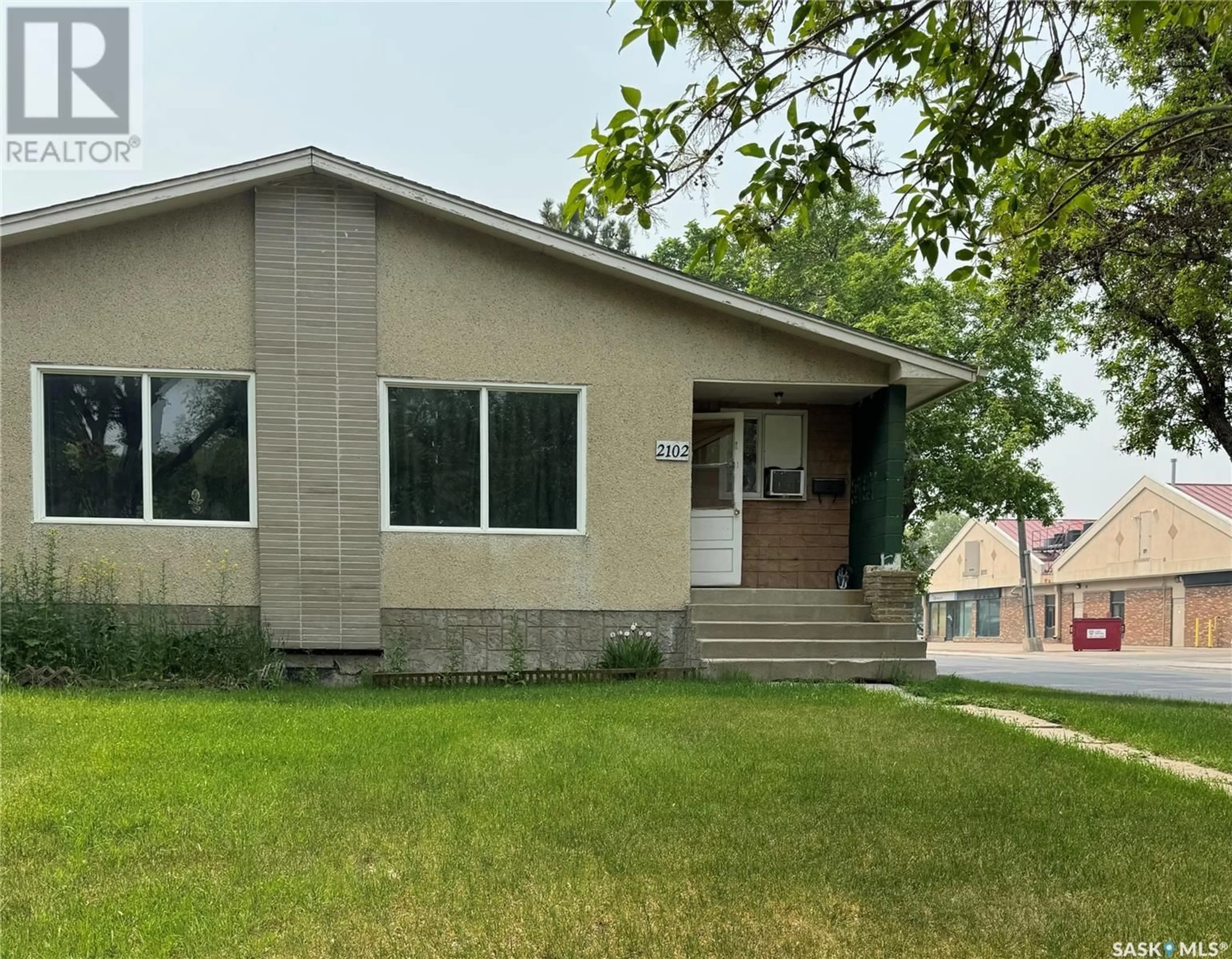 Home with vinyl exterior material, street for 2102-2104 ROTHWELL STREET, Regina Saskatchewan S4N2C4