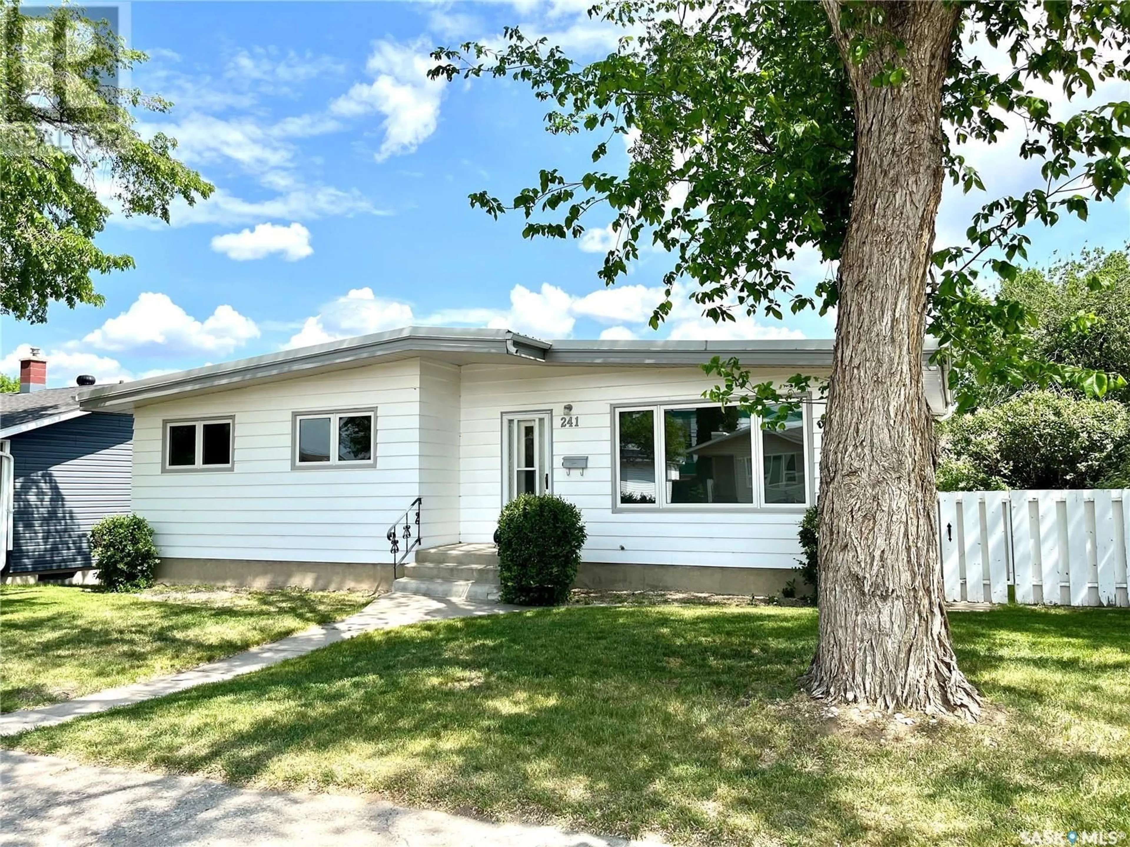 Home with vinyl exterior material, street for 241 CONLIN DRIVE, Swift Current Saskatchewan S9H3A6
