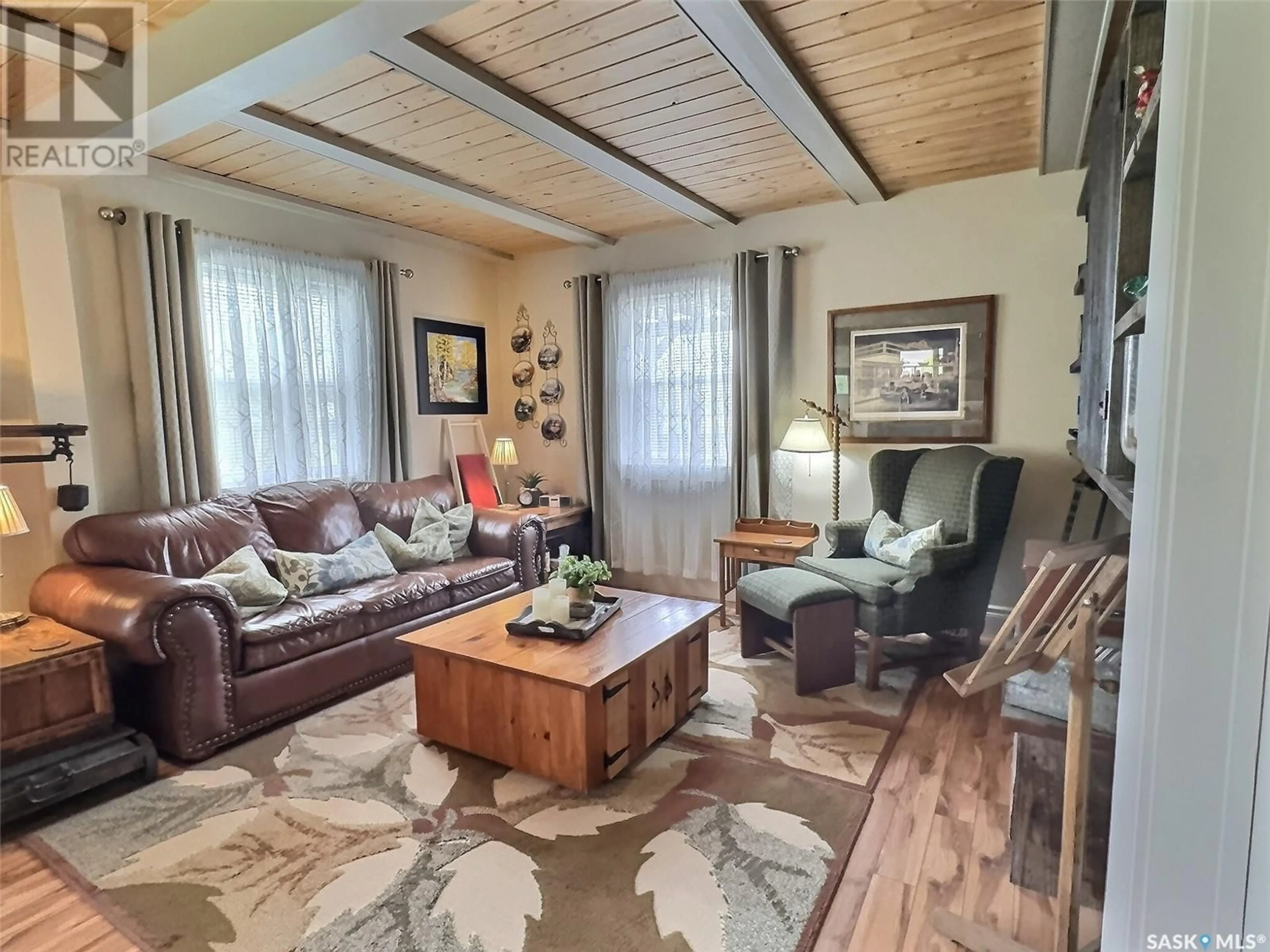 Living room with furniture, wood/laminate floor for 423 LAURIER STREET, Forget Saskatchewan S0C0X0
