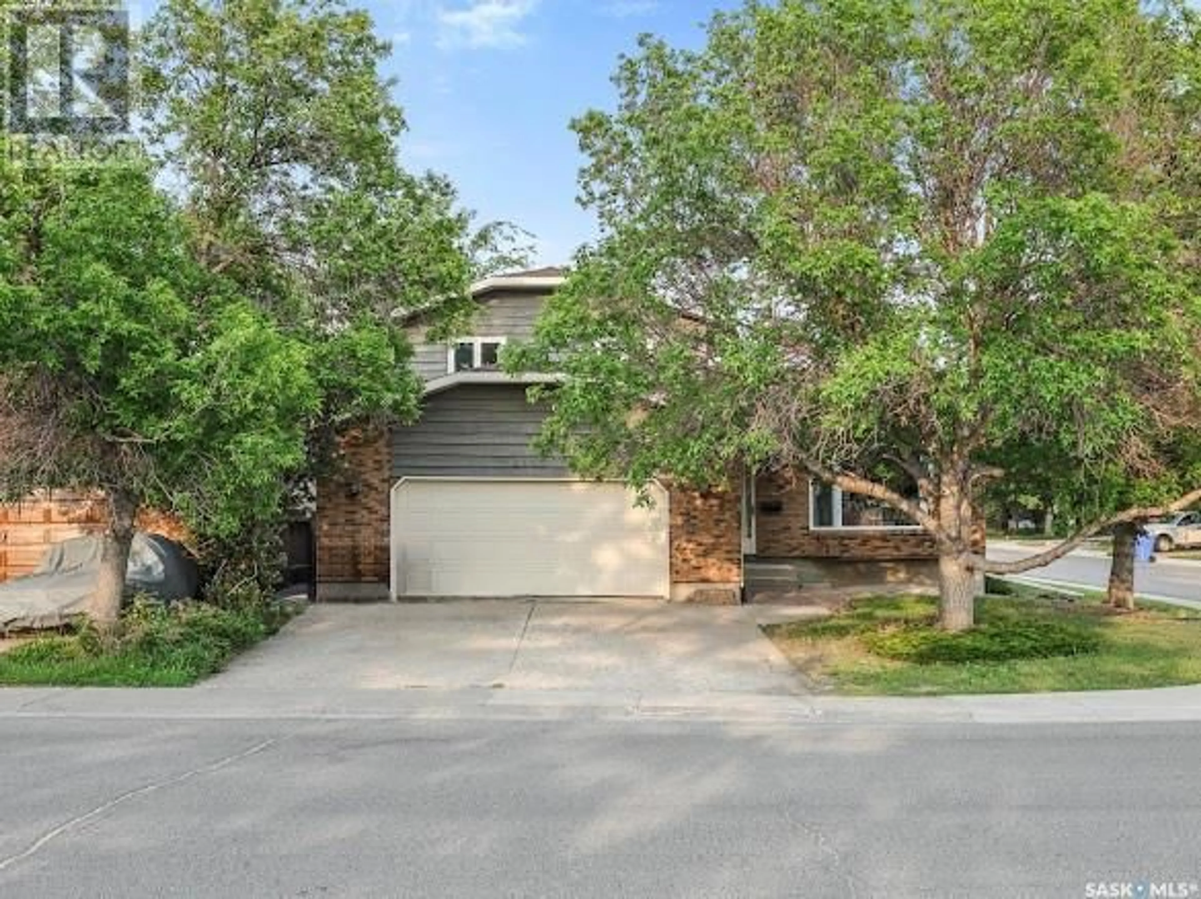 Home with brick exterior material, street for 2662 PHILIP ROAD, Regina Saskatchewan S4X2A9