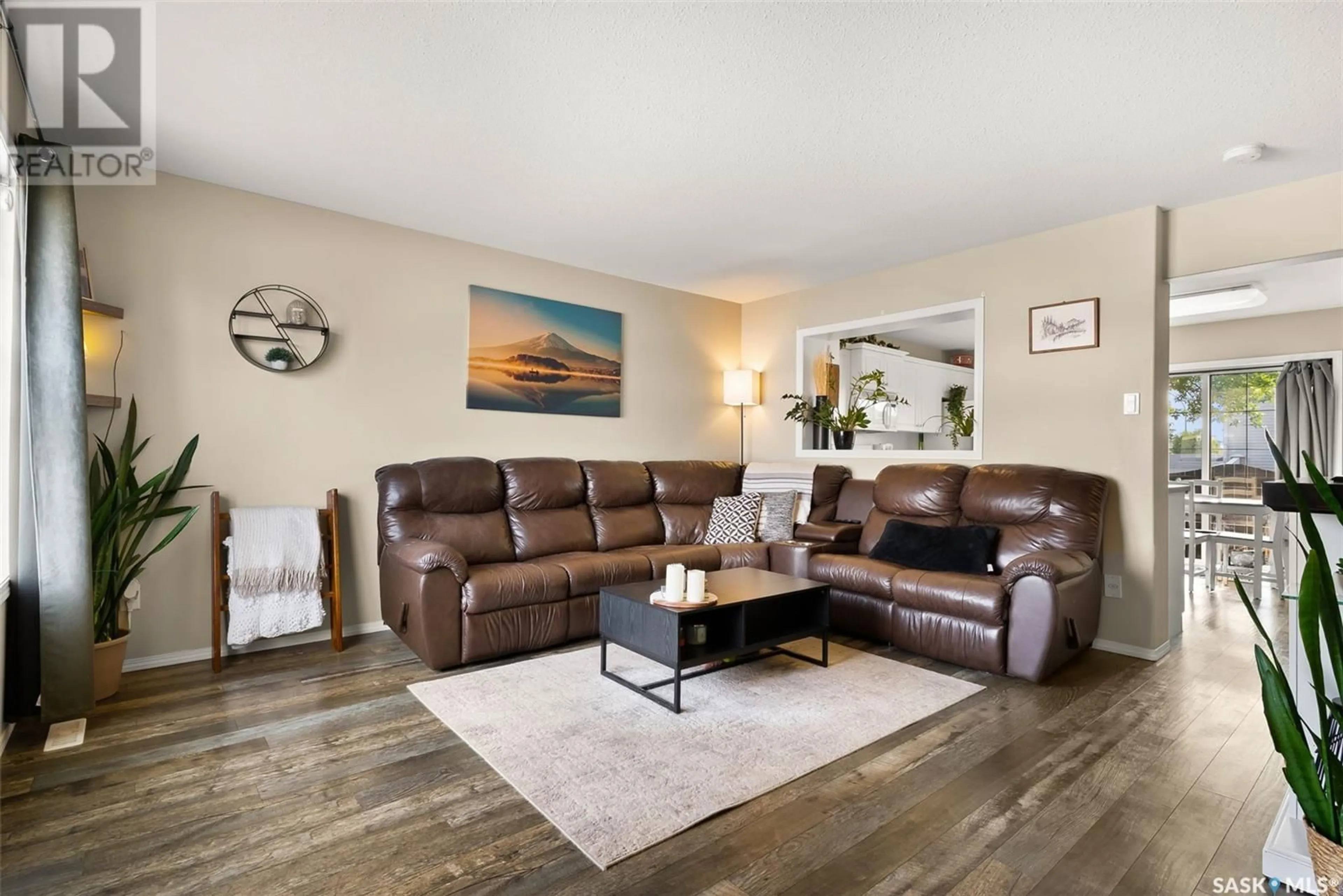 Living room with furniture, wood/laminate floor for 3754 7TH AVENUE E, Regina Saskatchewan S4N7R4