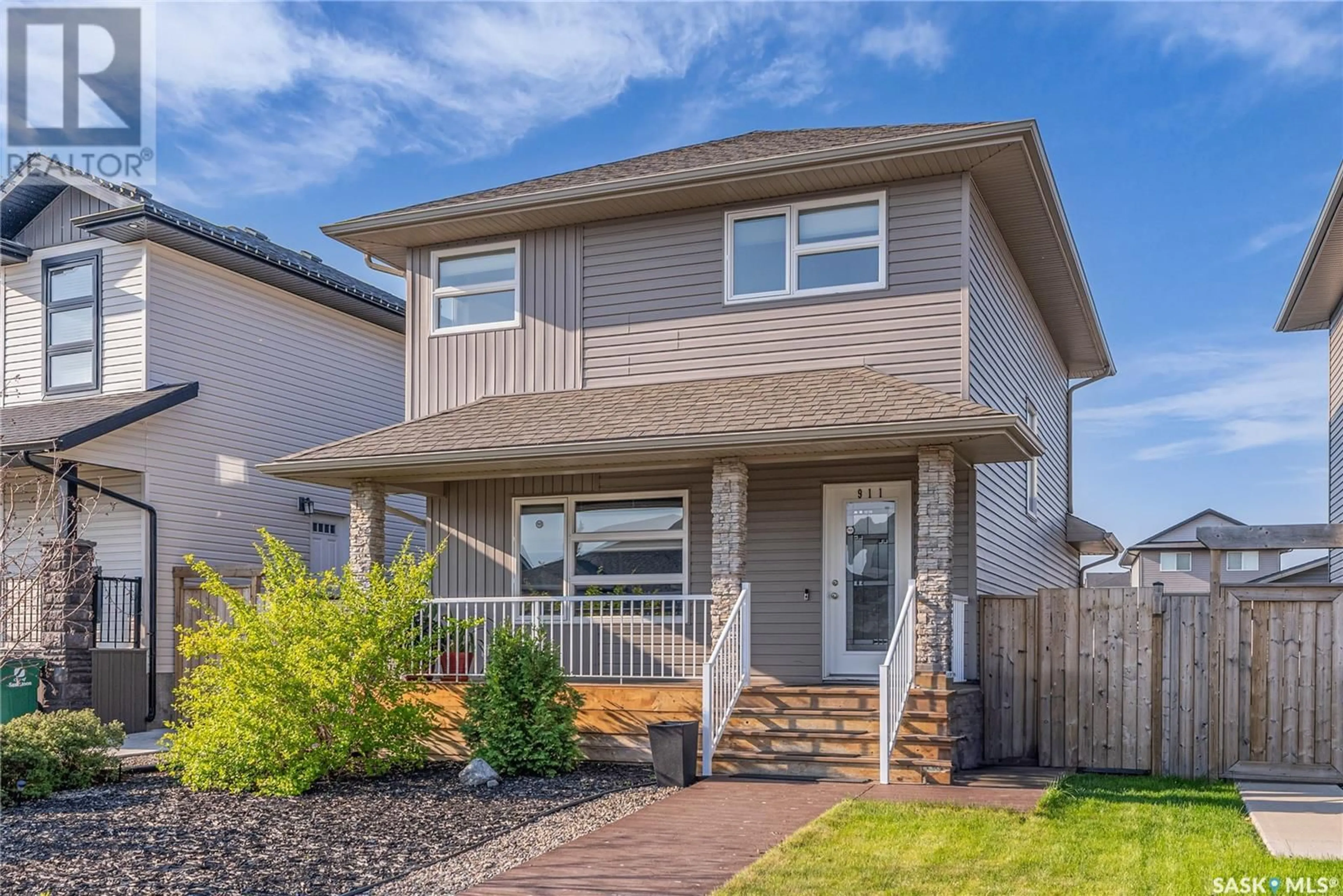 Home with vinyl exterior material, street for 911 KLOPPENBURG CRESCENT, Saskatoon Saskatchewan S7W0P2
