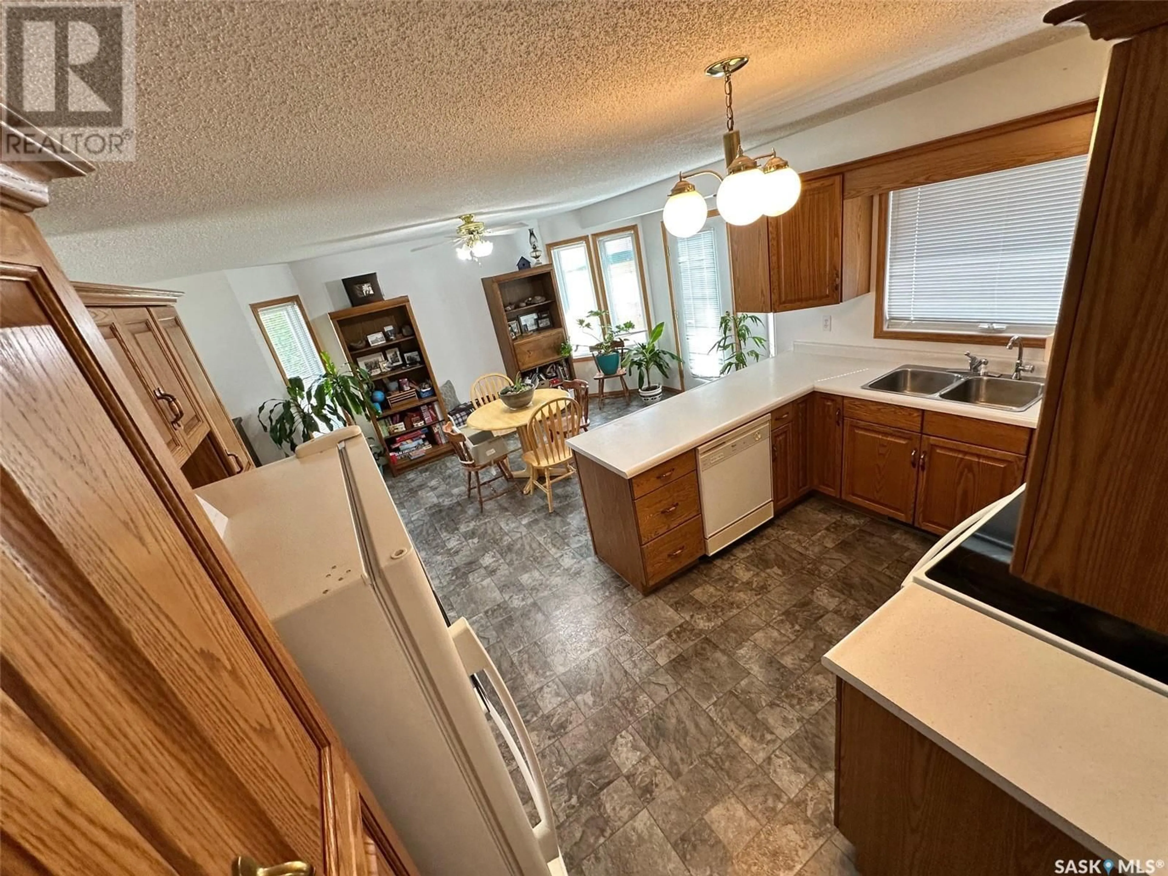 Open concept kitchen, ceramic/tile floor for 202 HAMJEA STREET, Hudson Bay Saskatchewan S0E0Y0