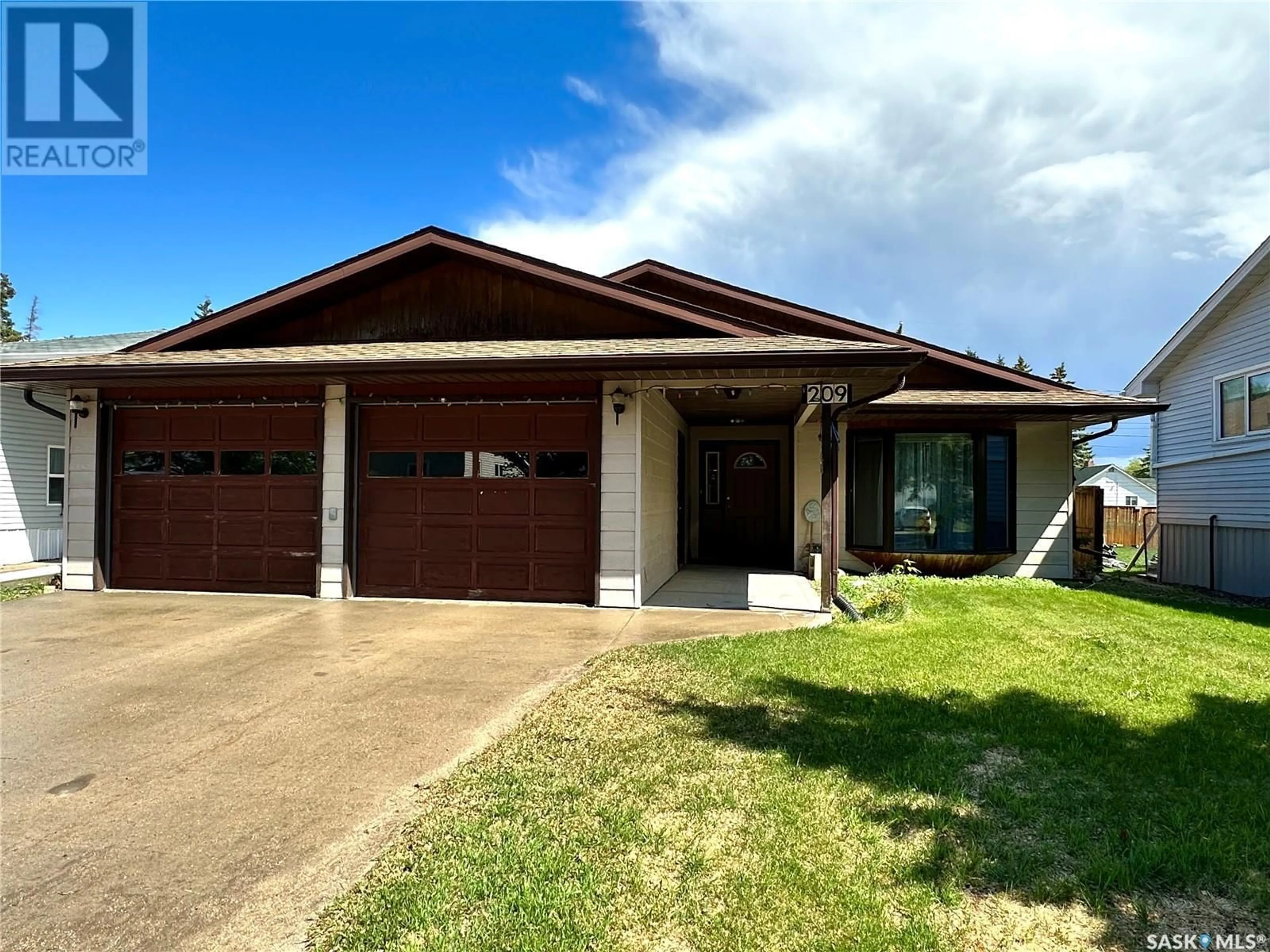 Home with vinyl exterior material, street for 209 1ST STREET, Spiritwood Saskatchewan S0J2M0
