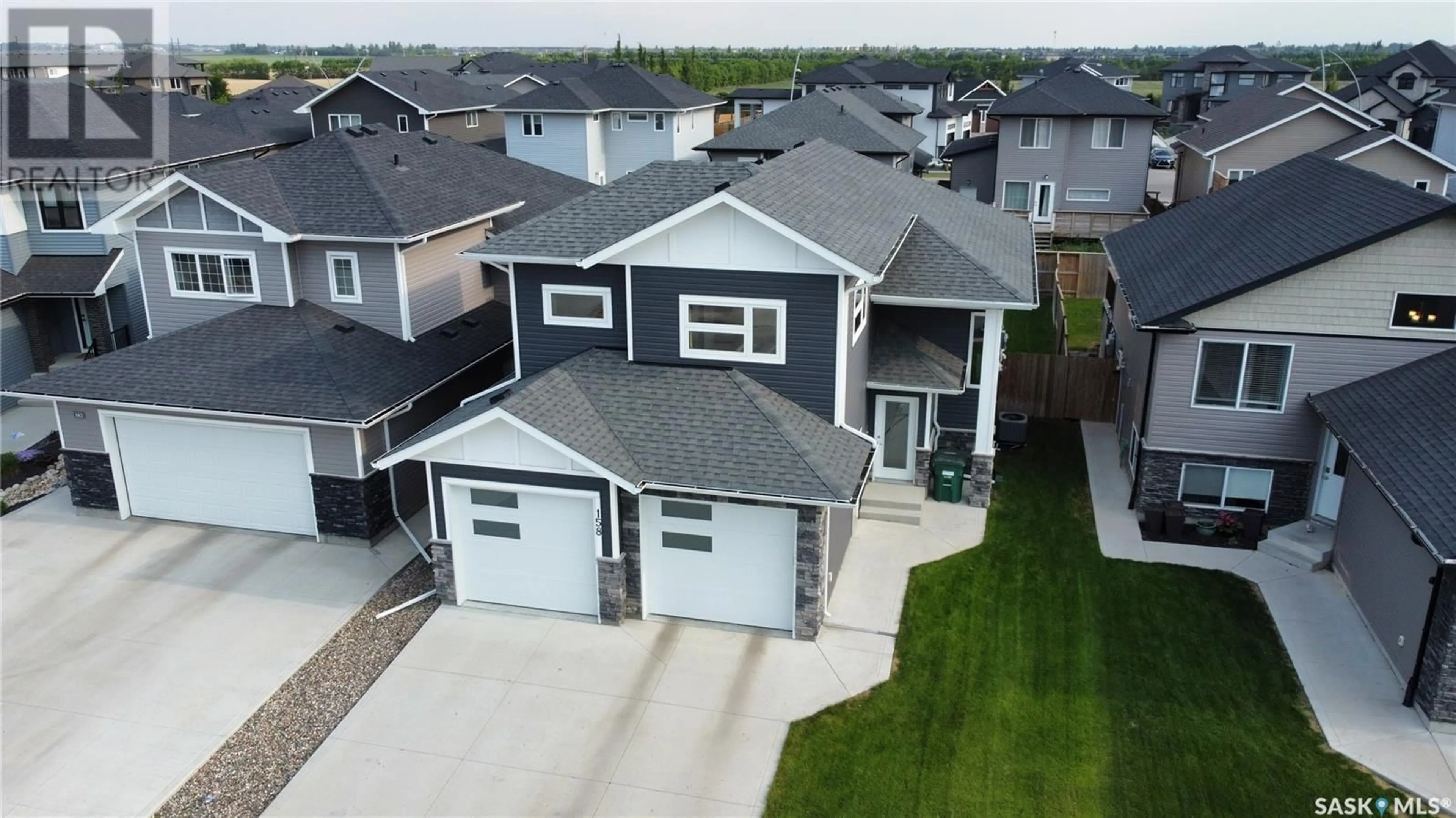 A pic from outside/outdoor area/front of a property/back of a property/a pic from drone, street for 158 BOYKOWICH BEND, Saskatoon Saskatchewan S7W0S4