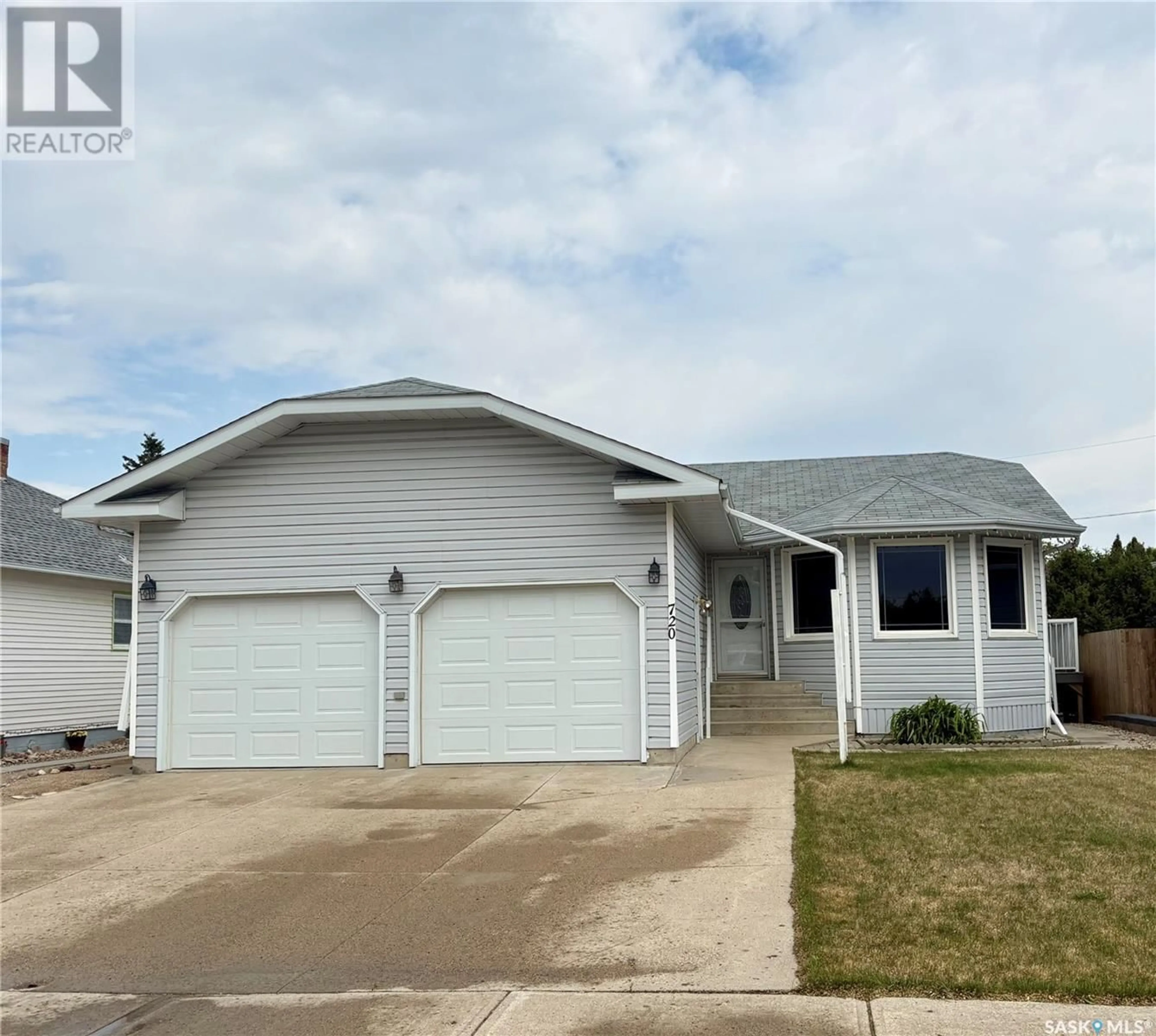 Home with vinyl exterior material, street for 720 12TH STREET, Humboldt Saskatchewan S0K2A0