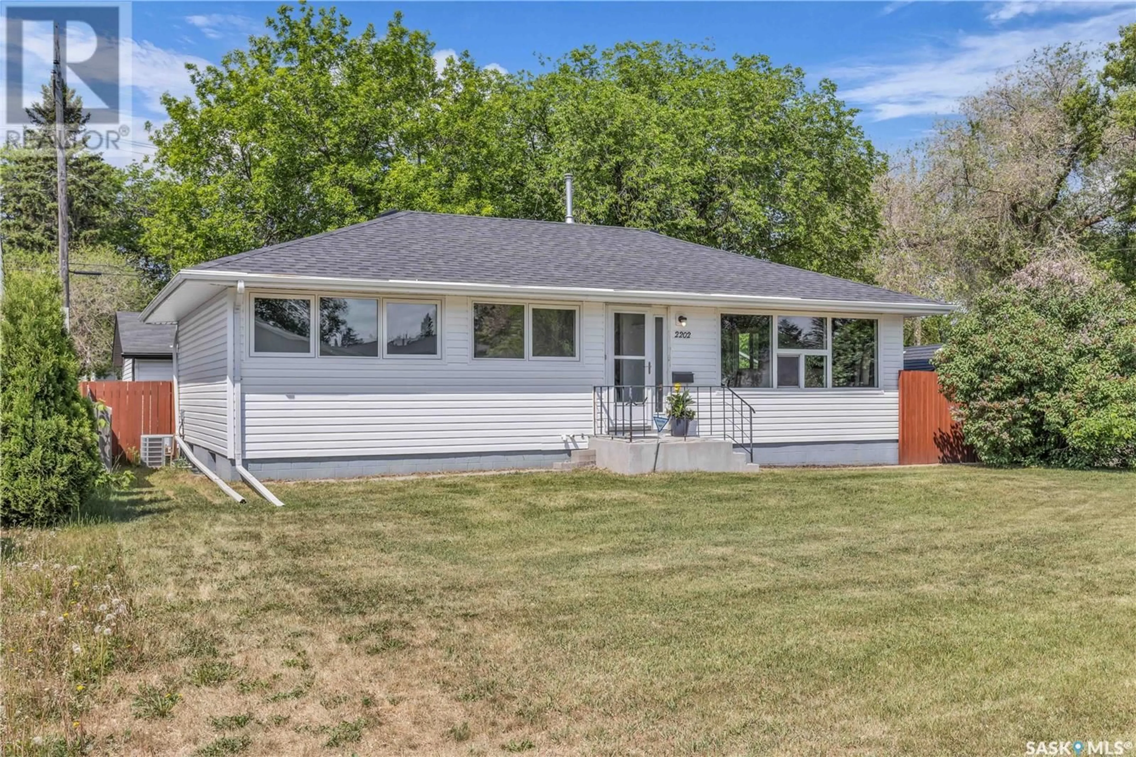 Home with vinyl exterior material, street for 2202 WILLIAM AVENUE, Saskatoon Saskatchewan S7J1A6