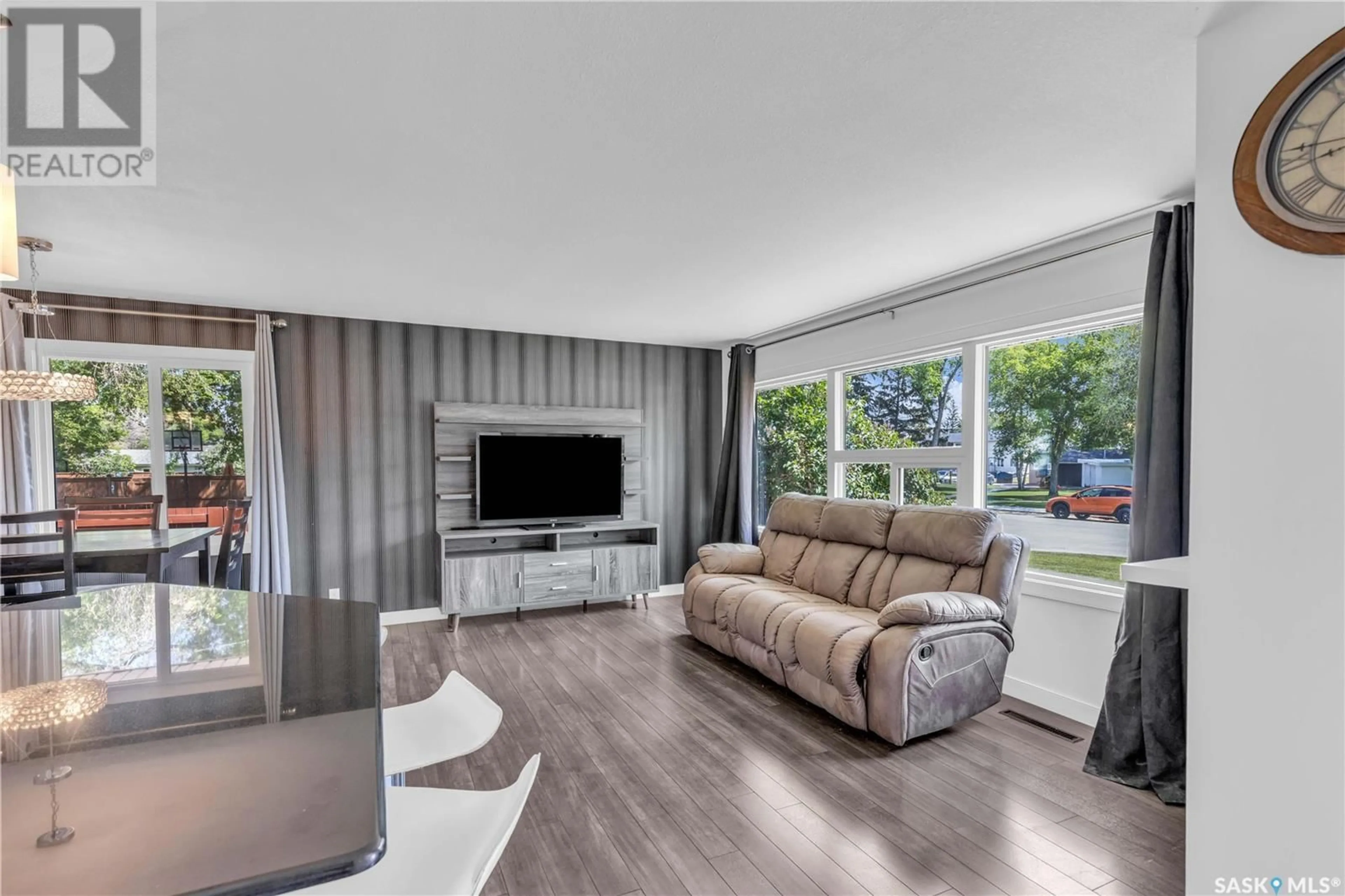 Living room with furniture, wood/laminate floor for 2202 WILLIAM AVENUE, Saskatoon Saskatchewan S7J1A6