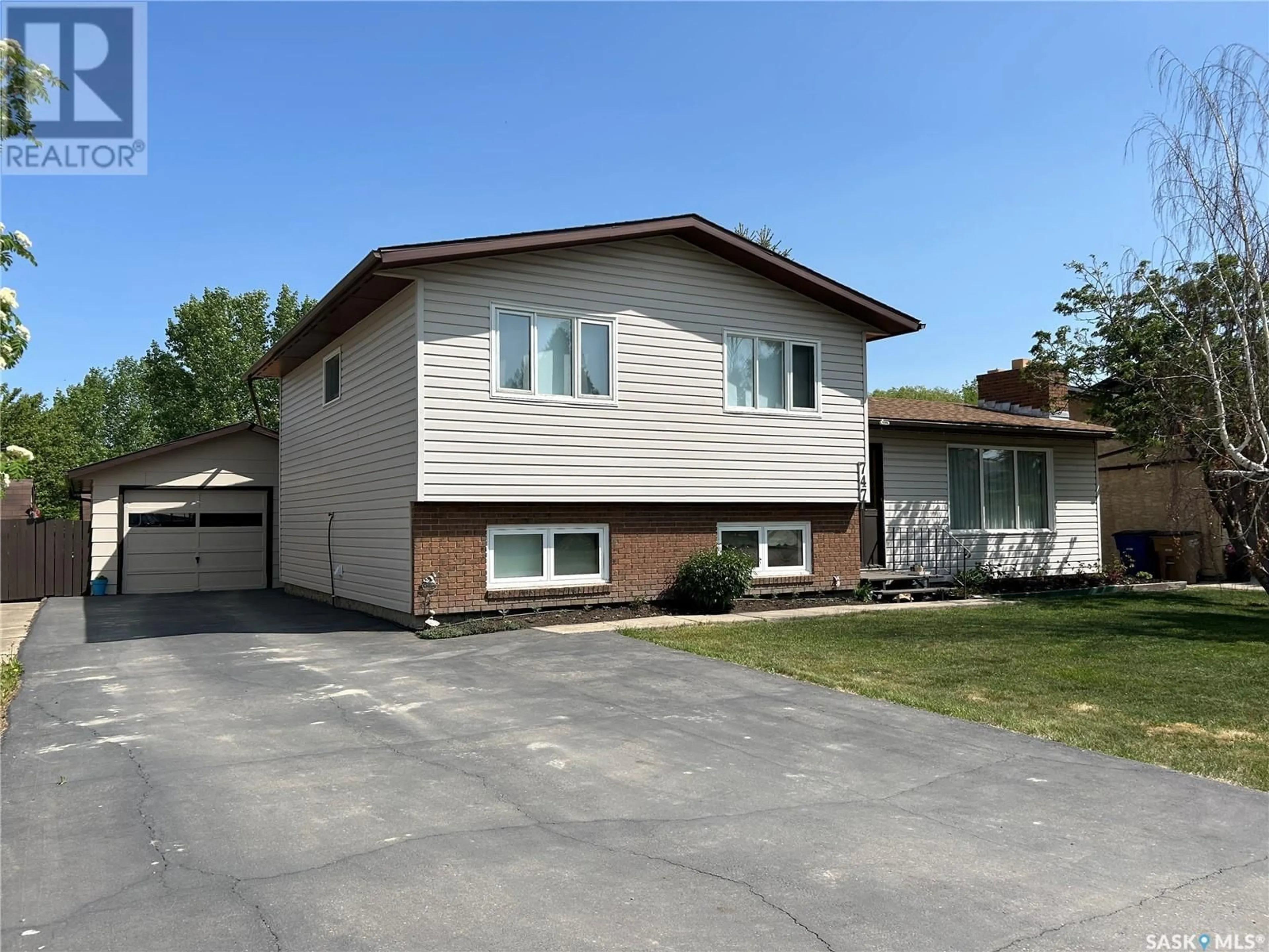 Home with vinyl exterior material, street for 747 GOLBURN CRESCENT, Tisdale Saskatchewan S0E1T0