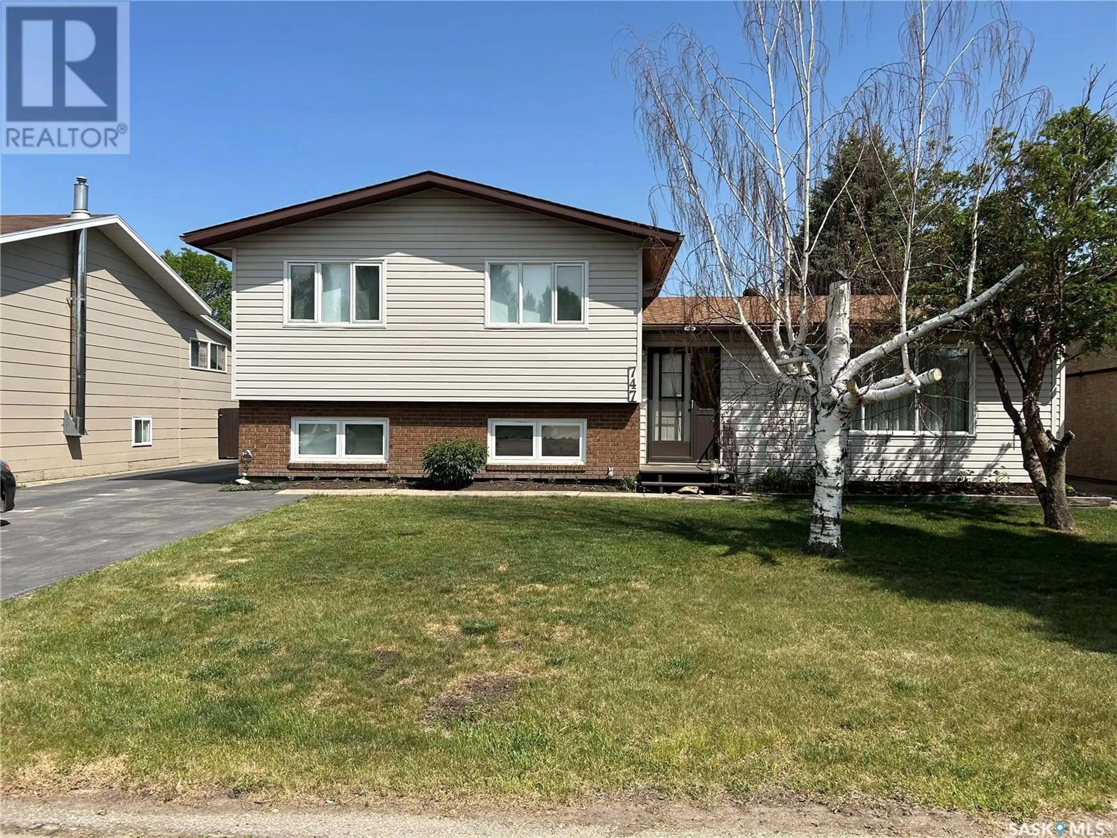 Home with vinyl exterior material, street for 747 GOLBURN CRESCENT, Tisdale Saskatchewan S0E1T0