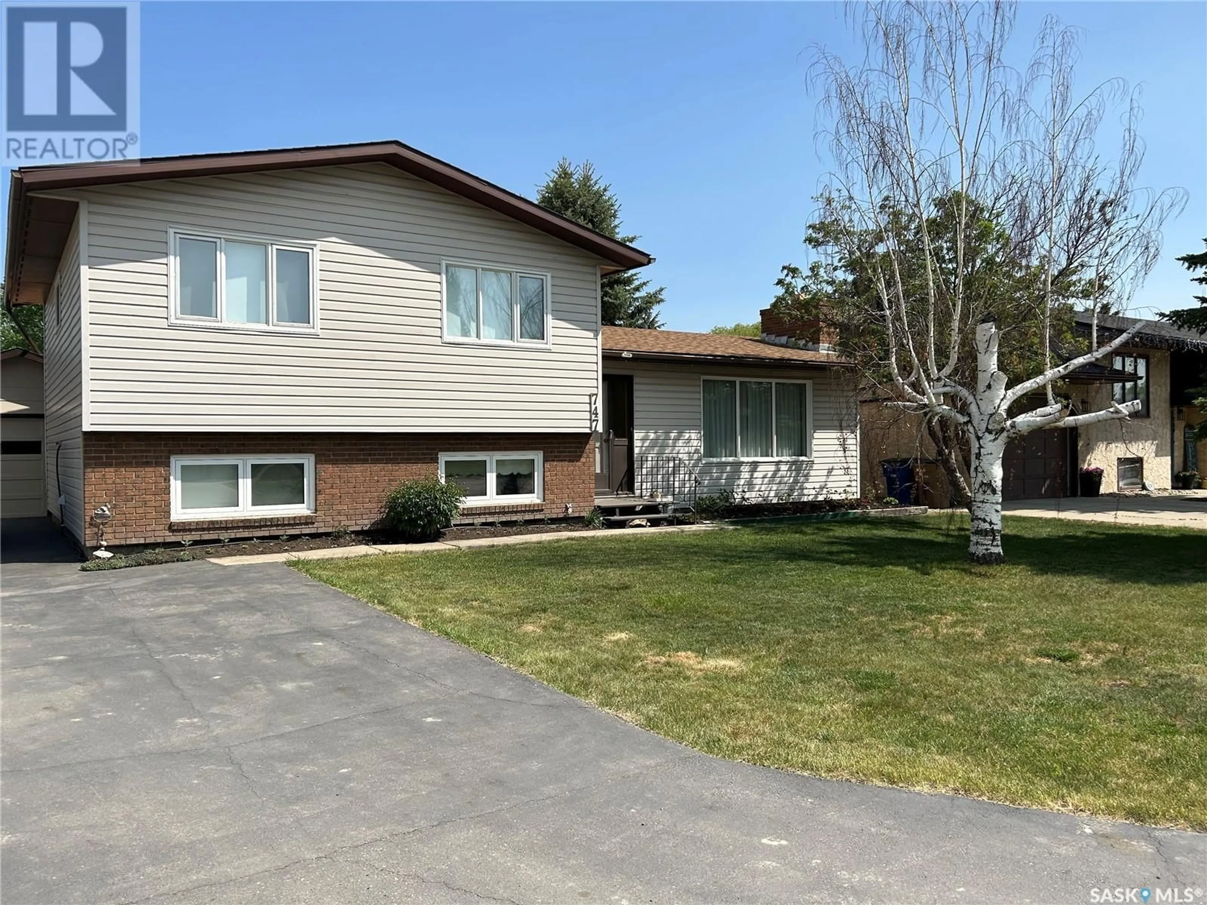 Home with vinyl exterior material, street for 747 GOLBURN CRESCENT, Tisdale Saskatchewan S0E1T0