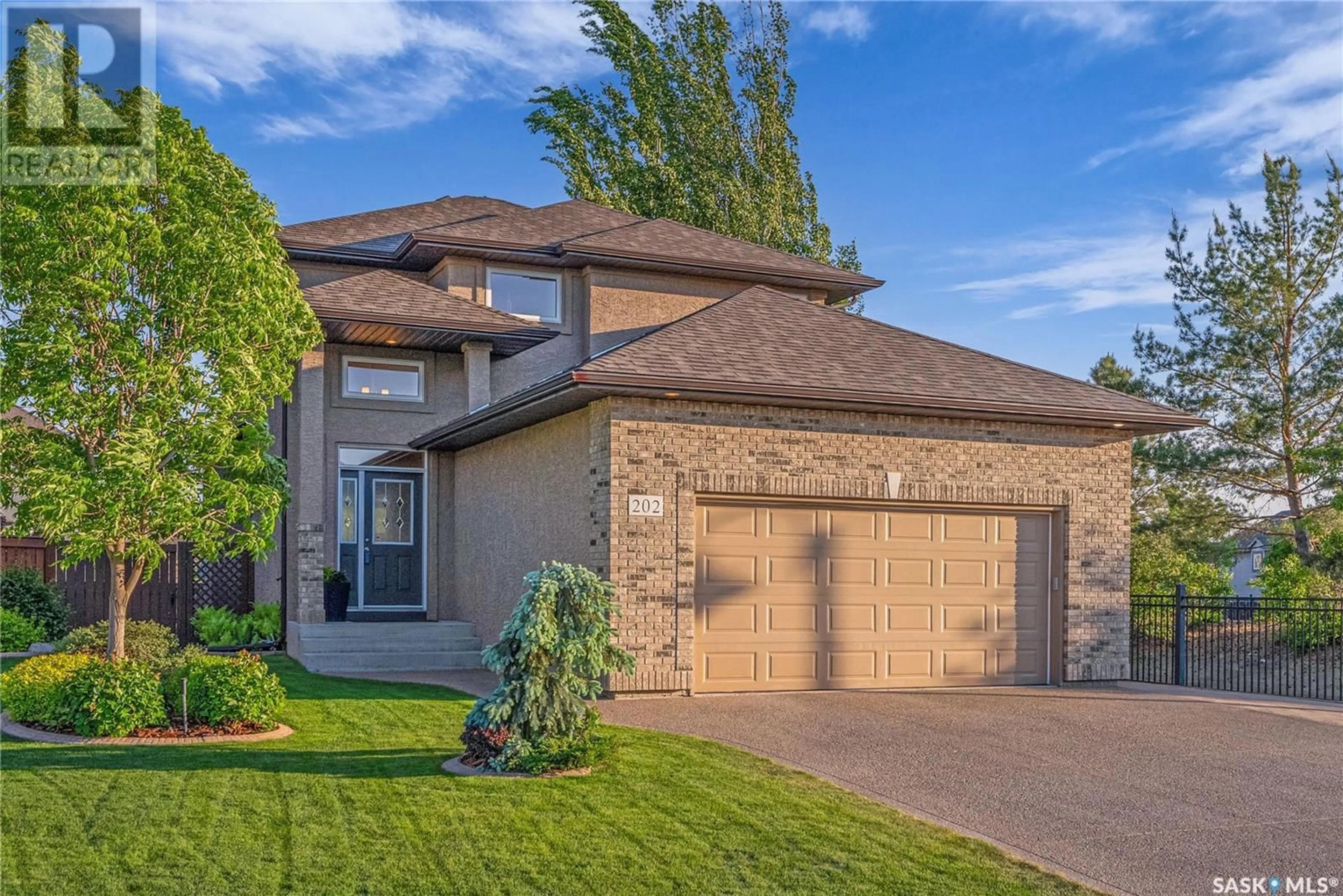 Home with brick exterior material, street for 202 ROBERTSON COVE, Saskatoon Saskatchewan S7T0E3
