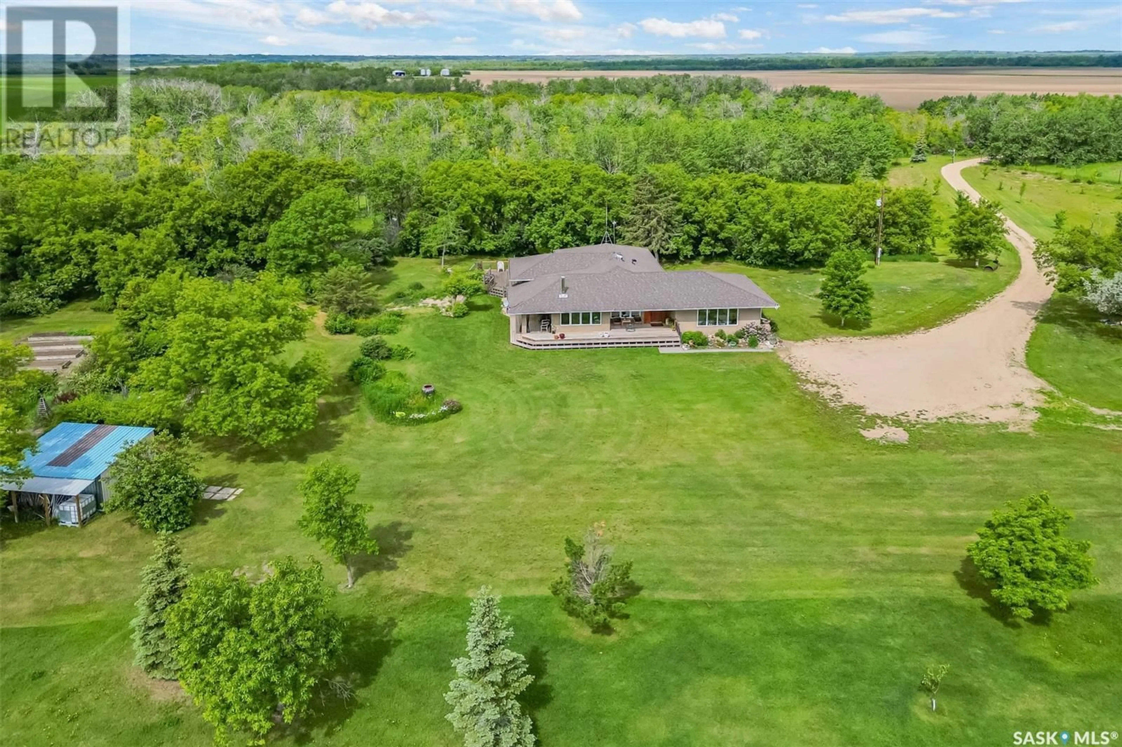A pic from outside/outdoor area/front of a property/back of a property/a pic from drone, water/lake/river/ocean view for SECLUDED SANCTUARY ACREAGE, Dundurn Rm No. 314 Saskatchewan S7K1M2