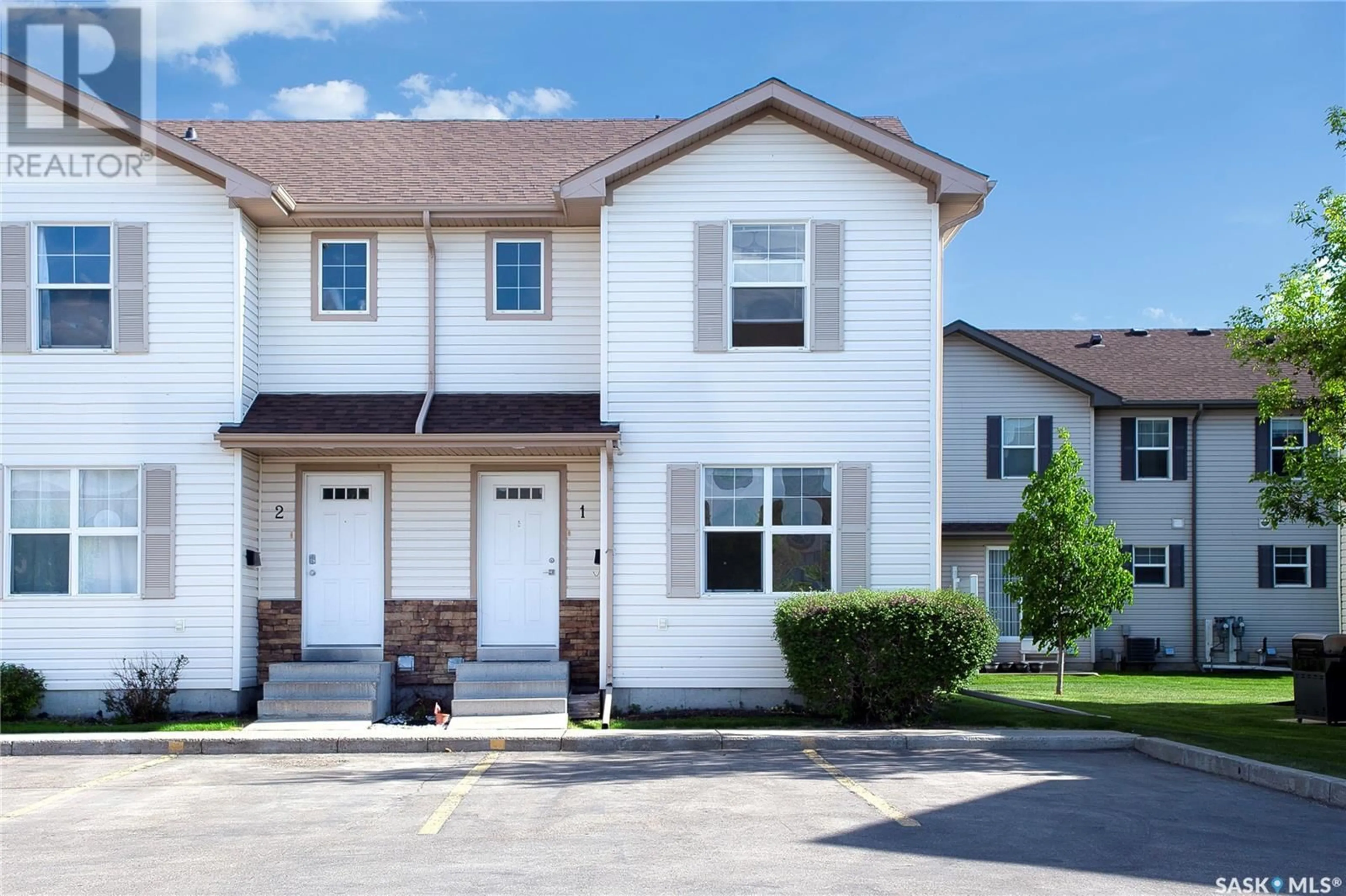 Home with vinyl exterior material, street for 1 - 135 PAWLYCHENKO LANE, Saskatoon Saskatchewan S7V1J8