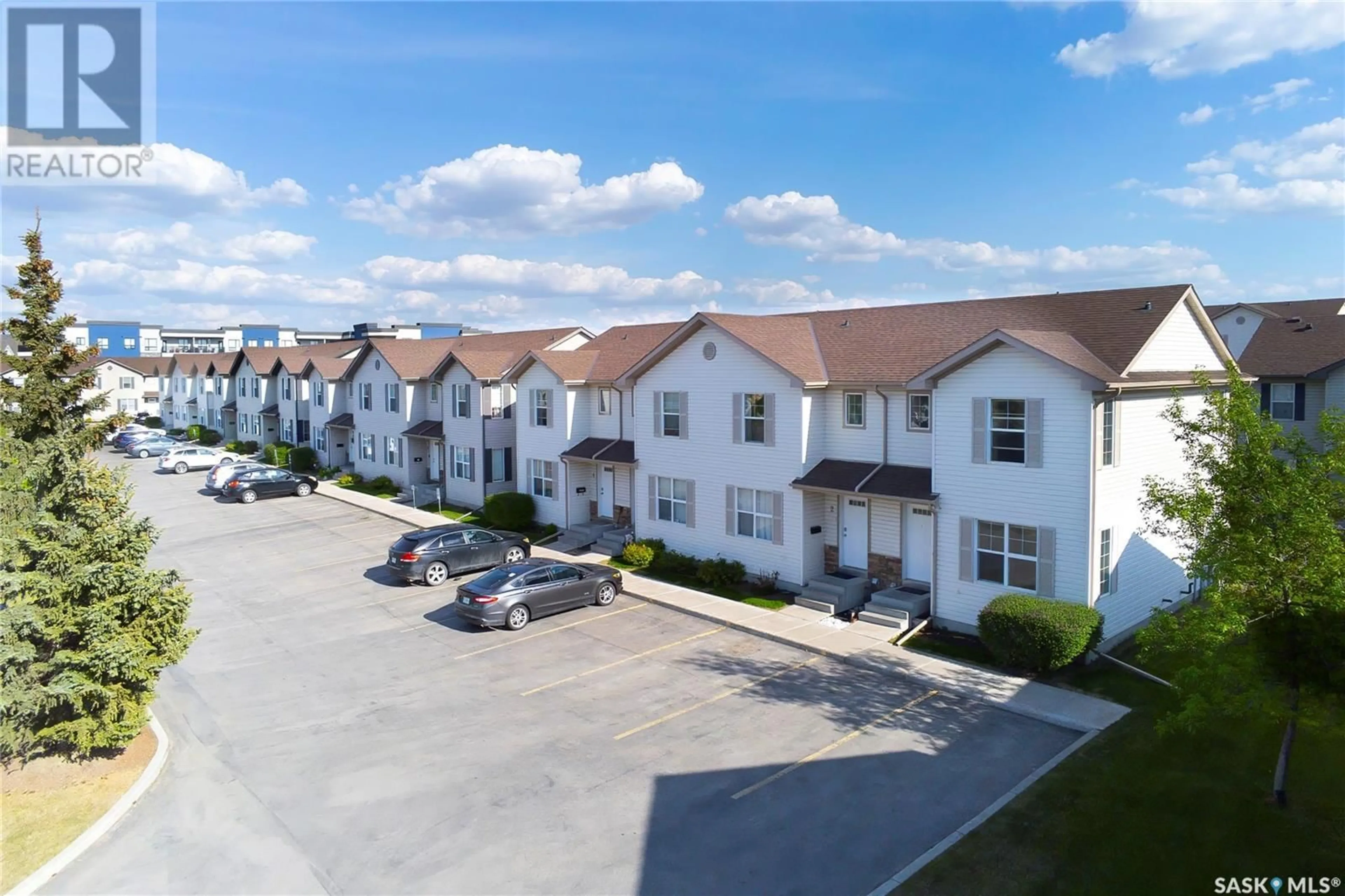 A pic from outside/outdoor area/front of a property/back of a property/a pic from drone, street for 1 - 135 PAWLYCHENKO LANE, Saskatoon Saskatchewan S7V1J8