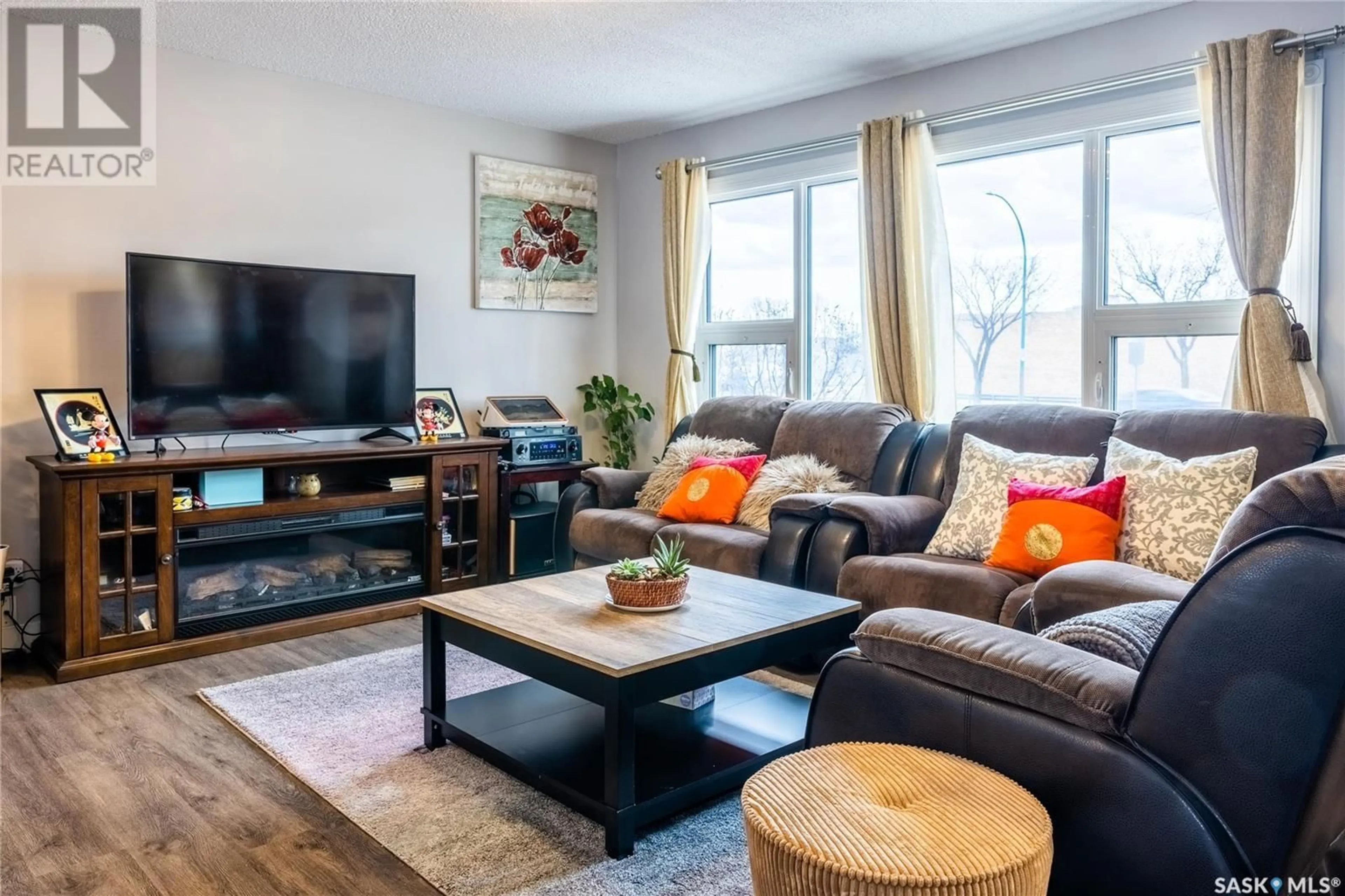 Living room with furniture, wood/laminate floor for 2305 TAYLOR STREET, Saskatoon Saskatchewan S7H1W8