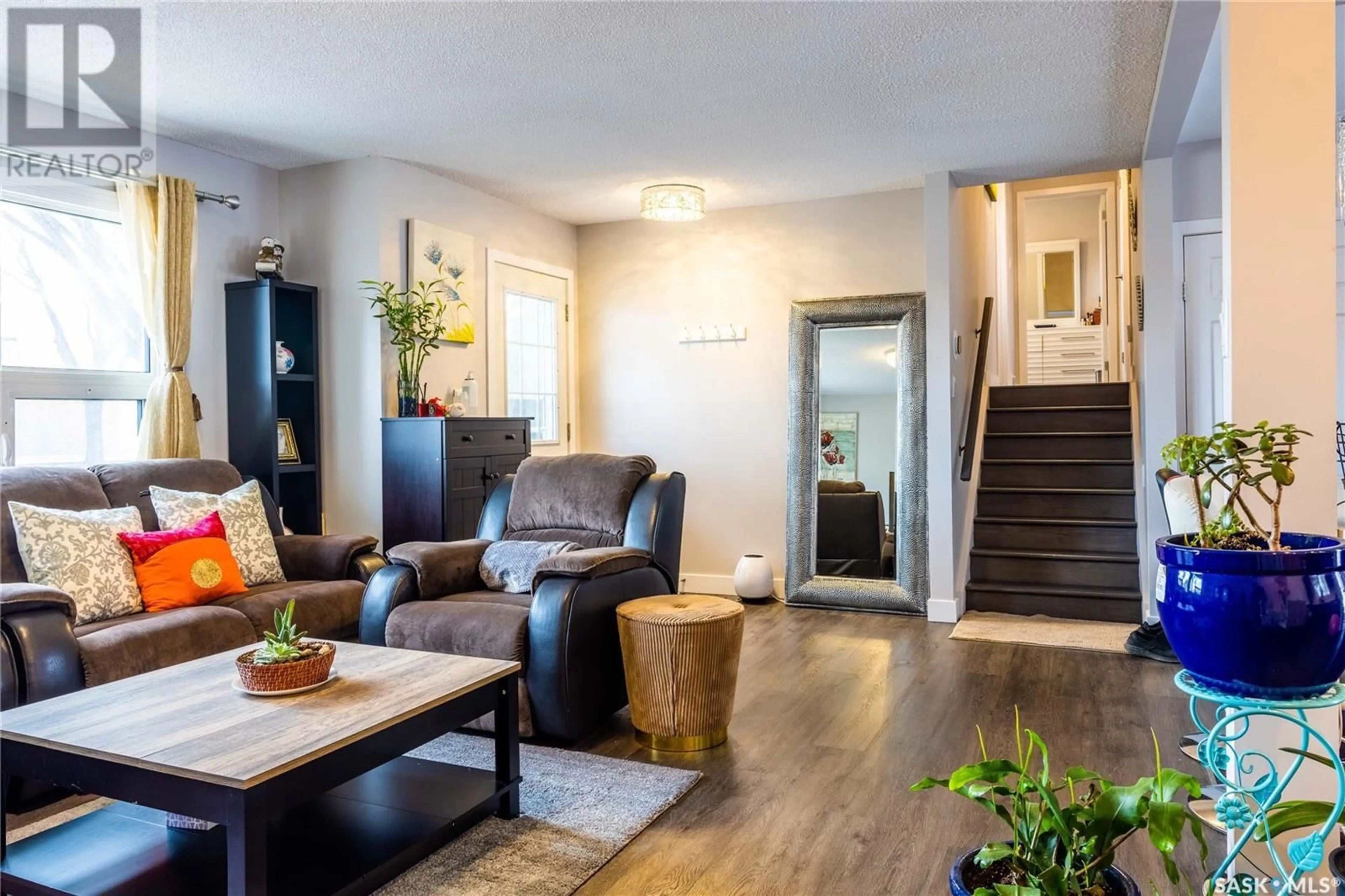 Living room with furniture, wood/laminate floor for 2305 TAYLOR STREET, Saskatoon Saskatchewan S7H1W8