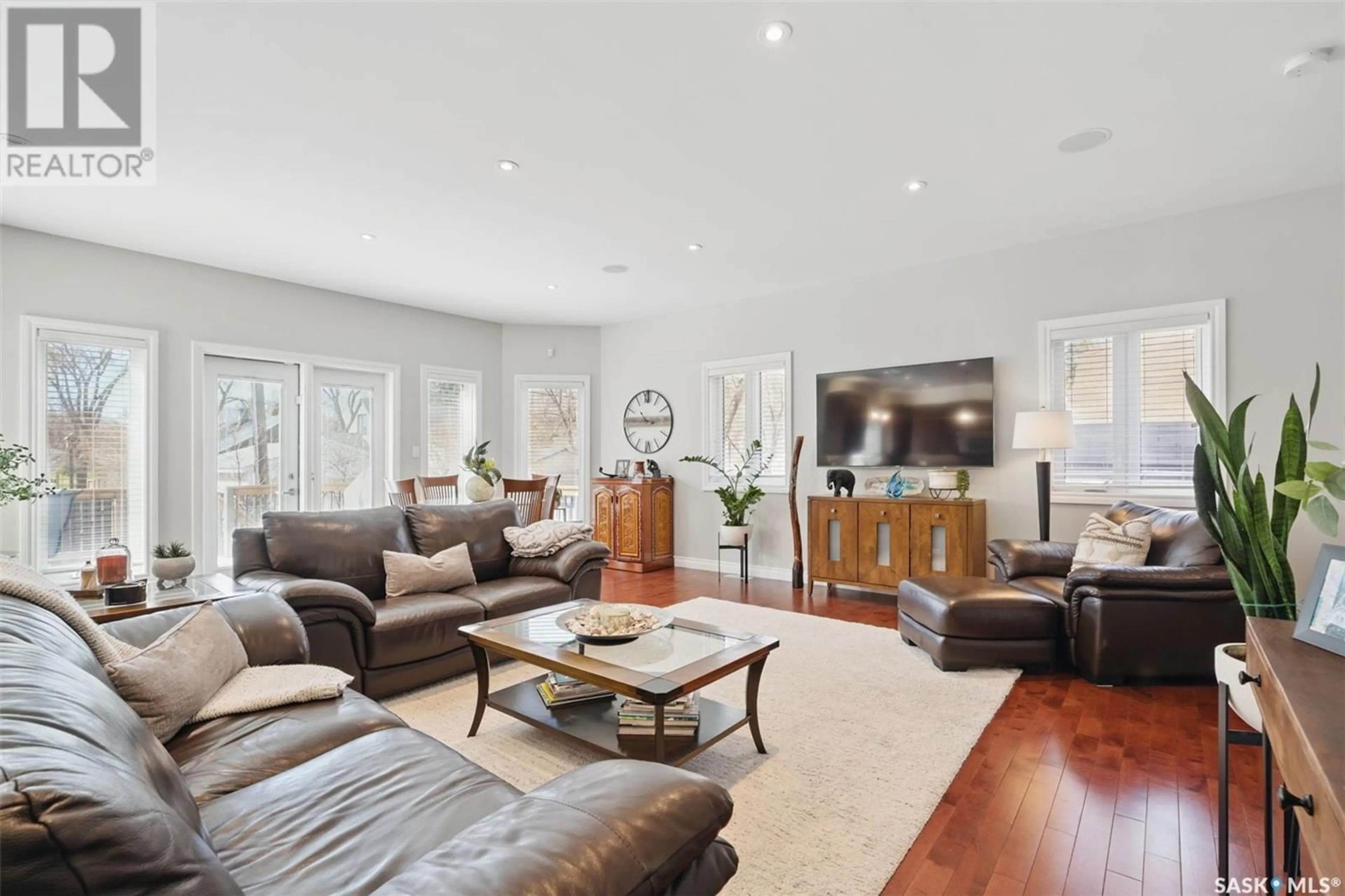 Living room with furniture, wood/laminate floor for 116 HILLIARD STREET, Saskatoon Saskatchewan S7J0E2