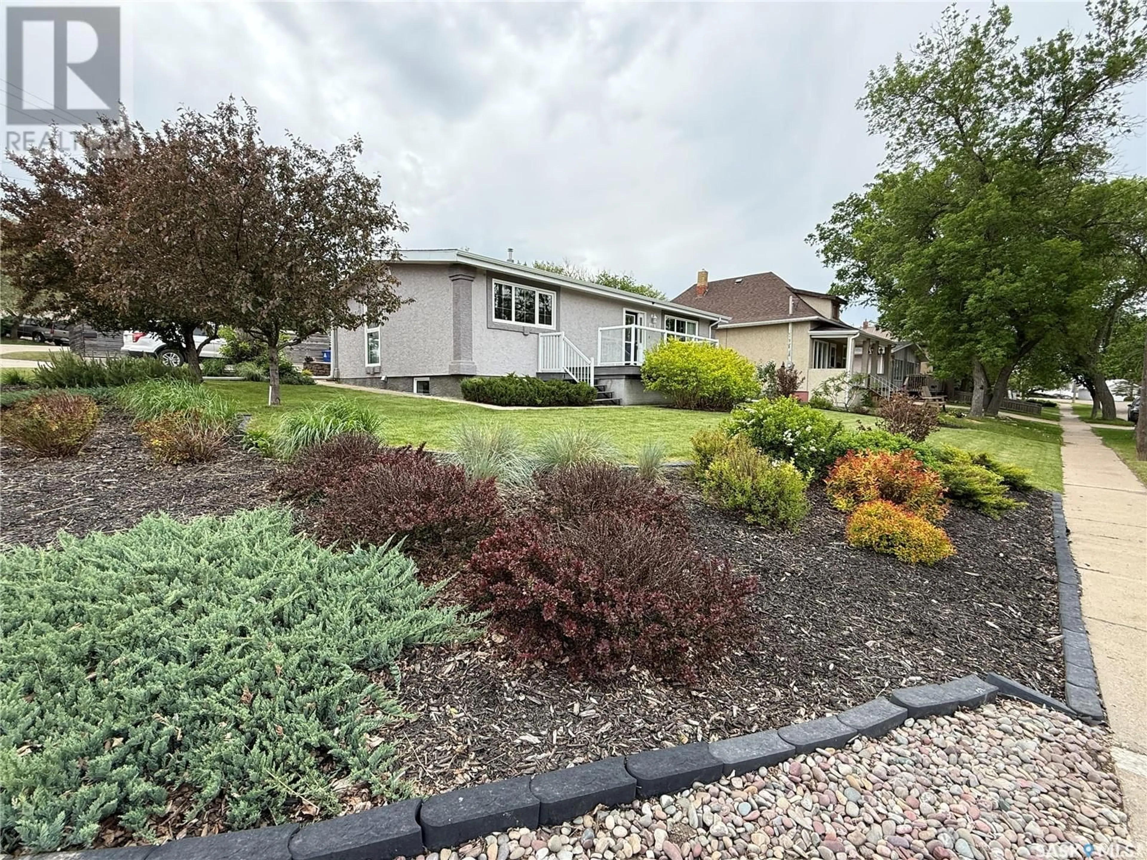 A pic from outside/outdoor area/front of a property/back of a property/a pic from drone, street for 318 CONFEDERATION DRIVE, Weyburn Saskatchewan S4H2G8