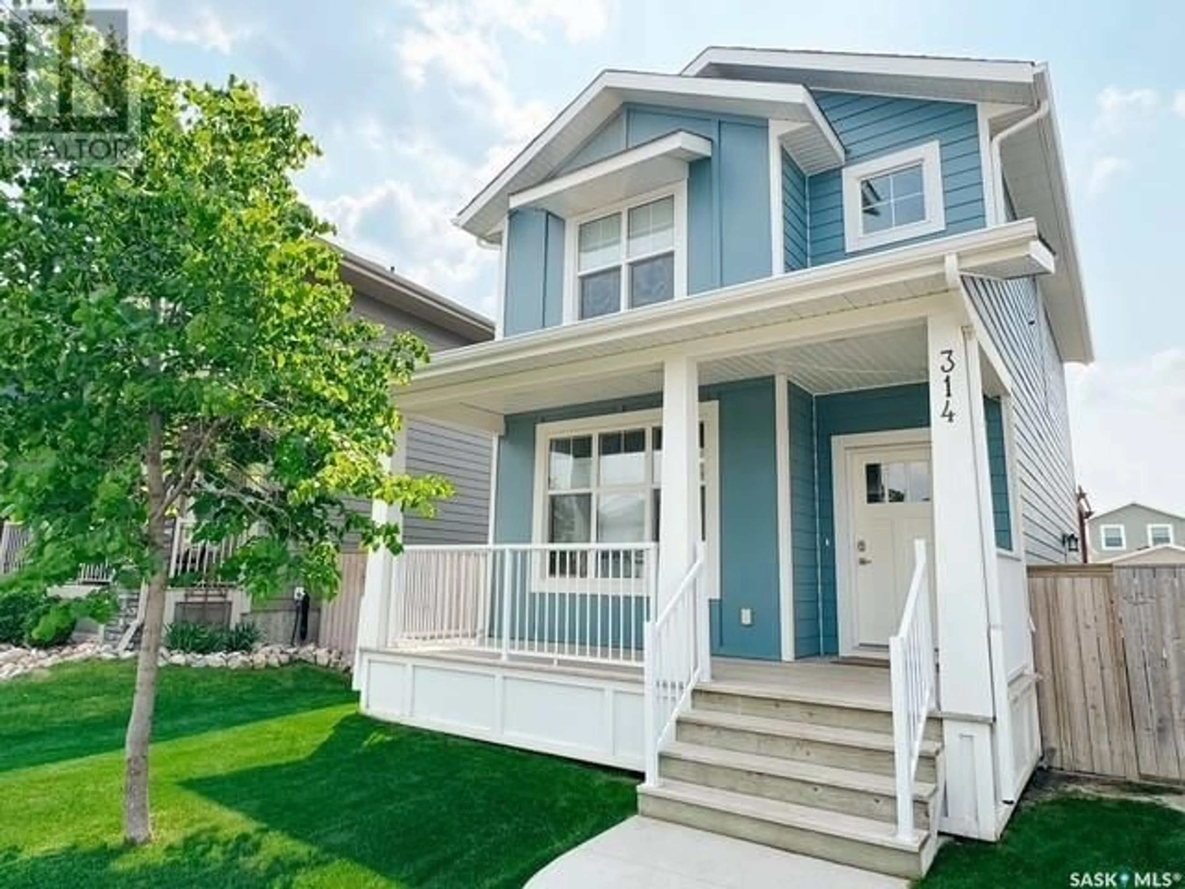 Home with vinyl exterior material, street for 314 EATON LANE, Saskatoon Saskatchewan S7V0H3