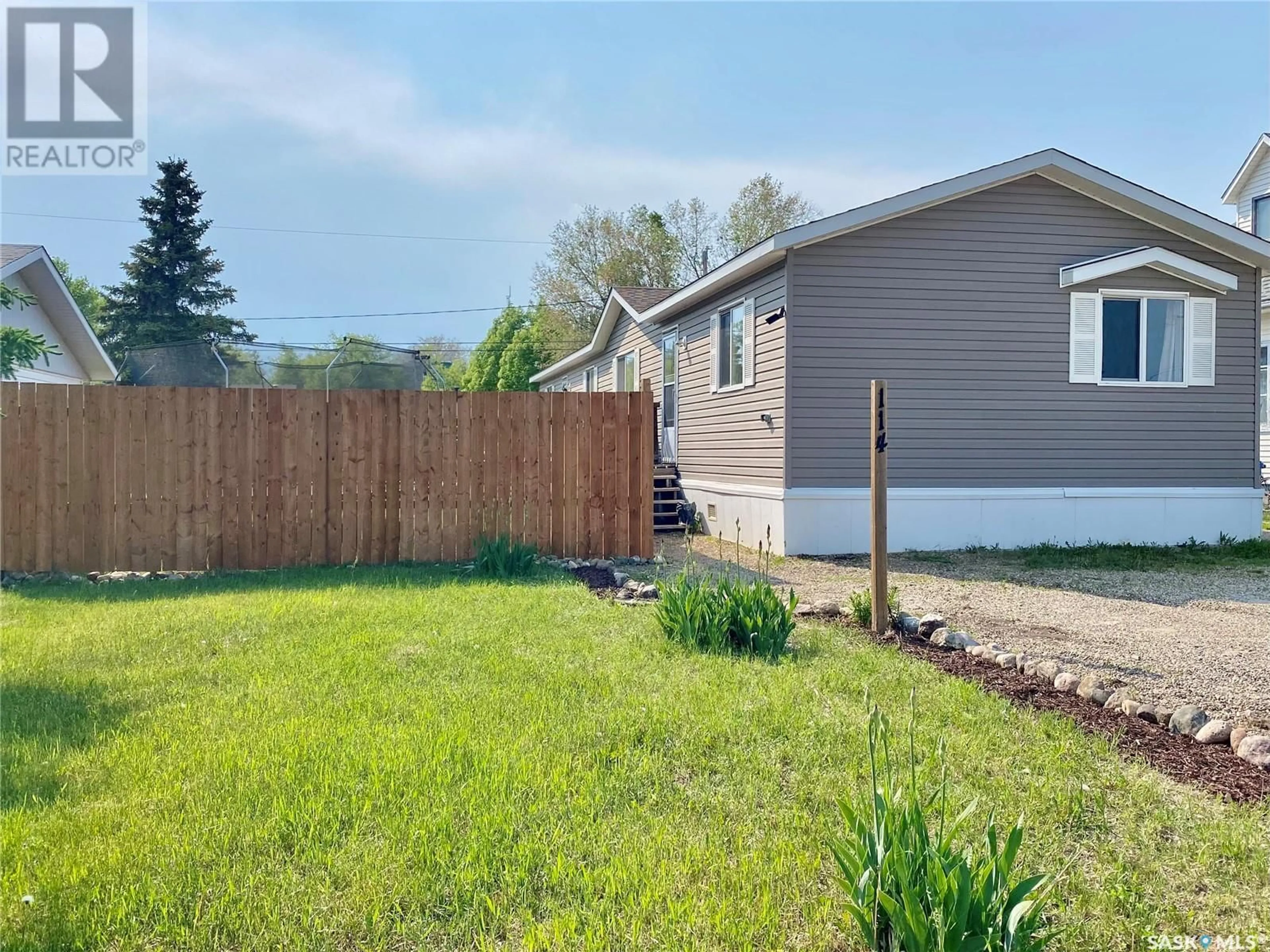 Home with vinyl exterior material, street for E - 114 3 STREET, Carnduff Saskatchewan S0C0S0