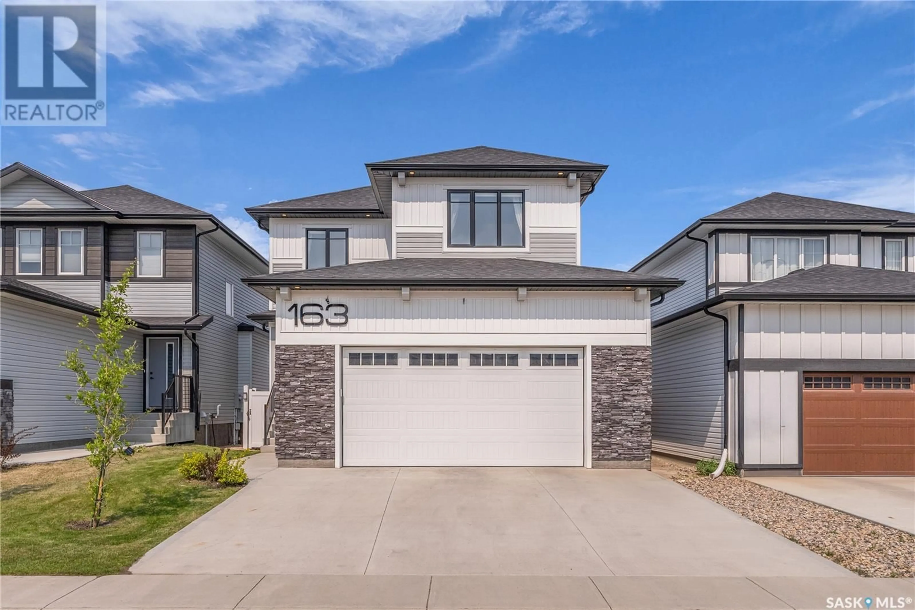 Home with vinyl exterior material, street for 163 CHELSOM BEND, Saskatoon Saskatchewan S7V0Z9