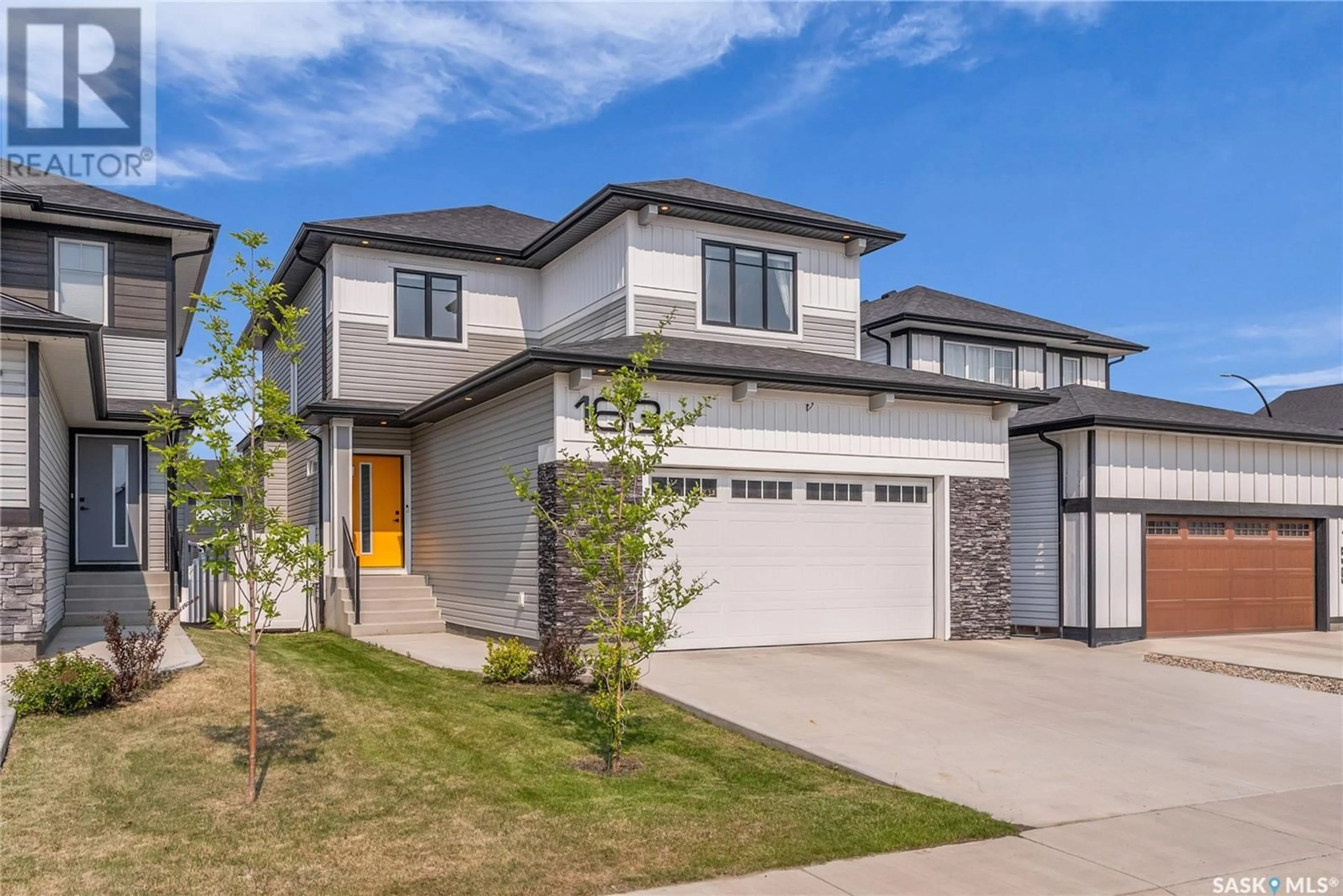 Home with vinyl exterior material, street for 163 CHELSOM BEND, Saskatoon Saskatchewan S7V0Z9