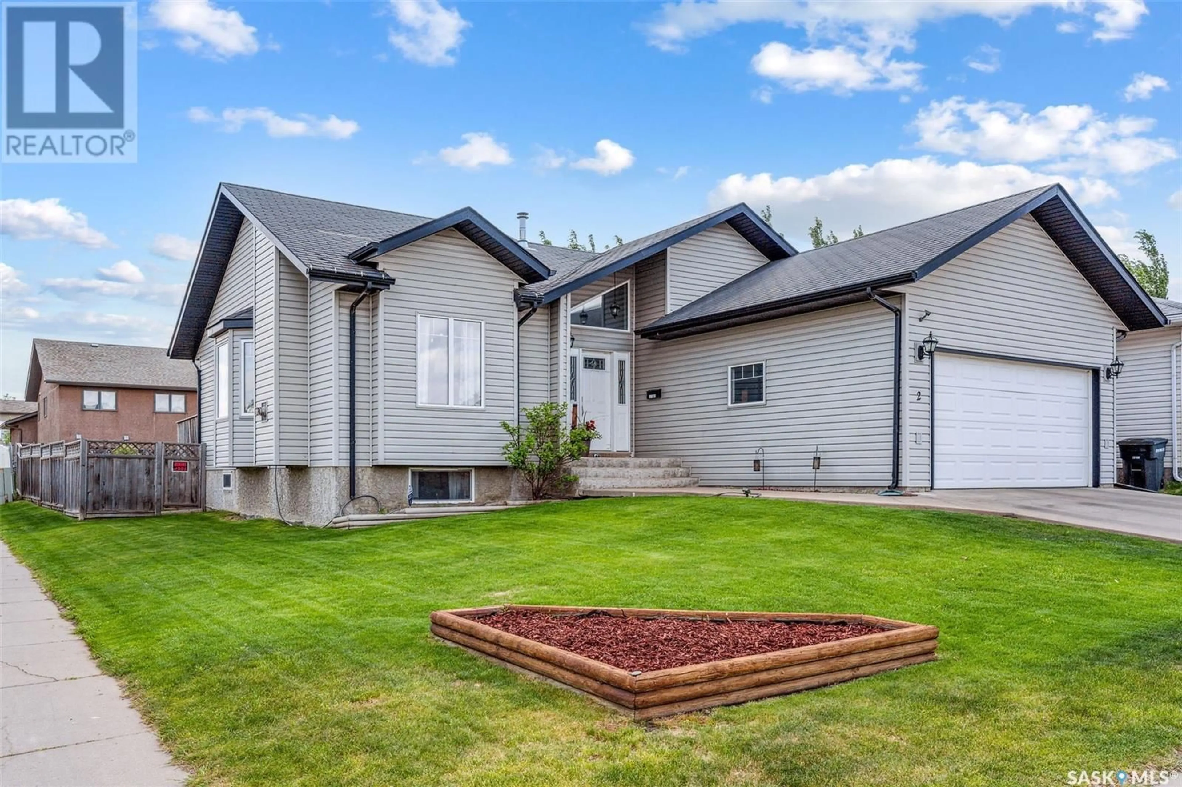 Home with vinyl exterior material, street for 2 TELFER BAY, Prince Albert Saskatchewan S6X1C4