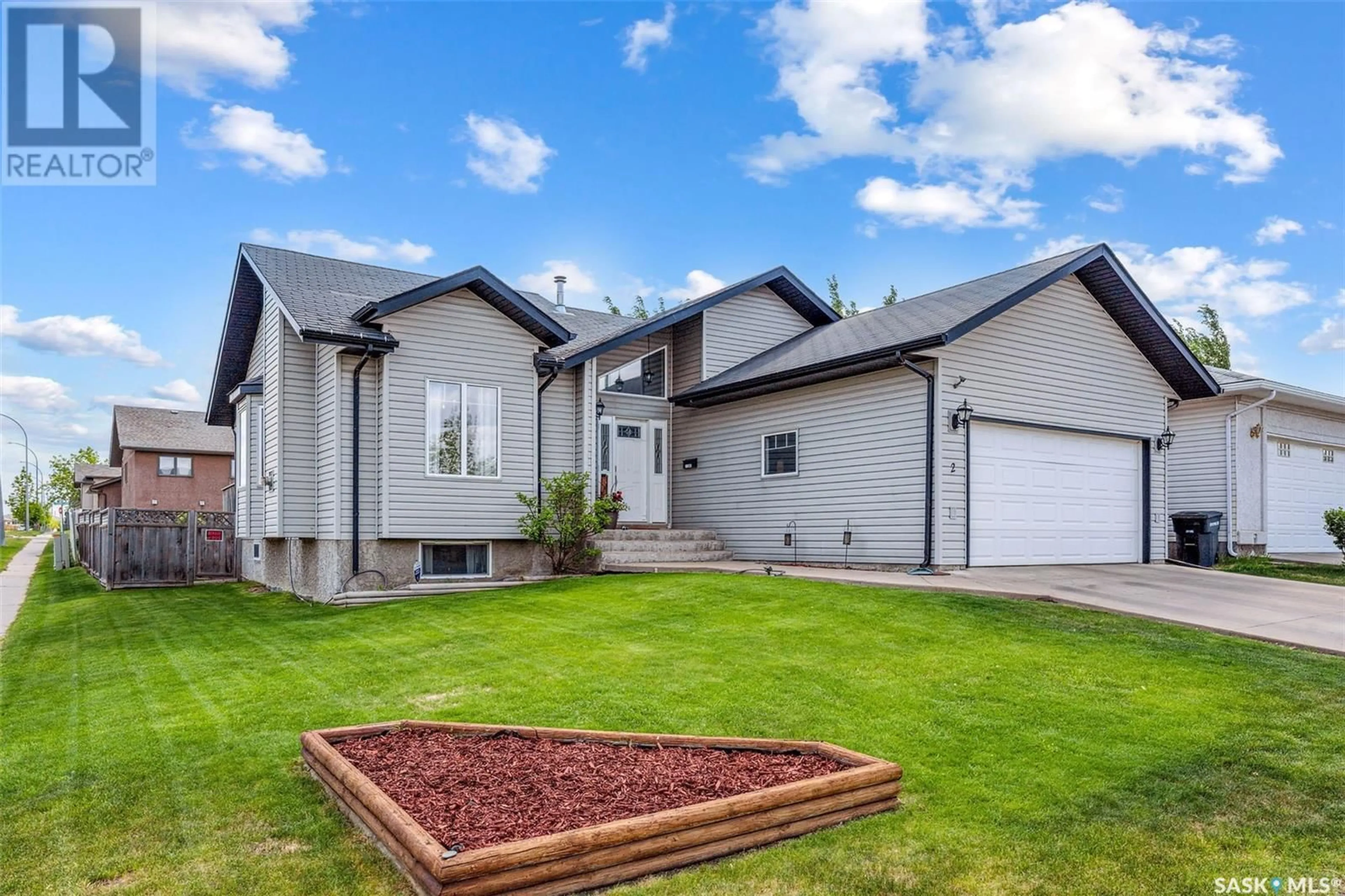 Home with vinyl exterior material, street for 2 TELFER BAY, Prince Albert Saskatchewan S6X1C4