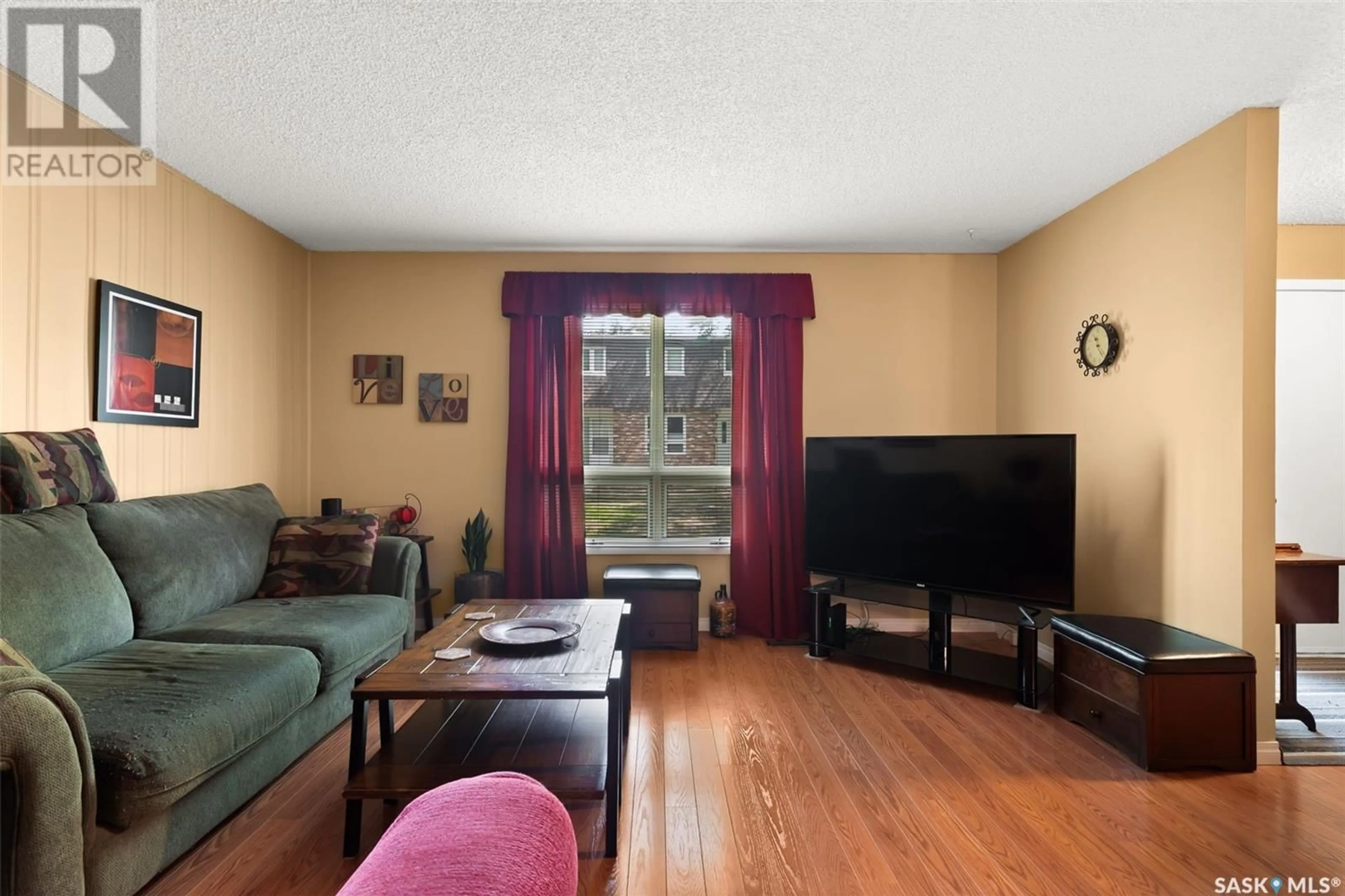 Living room with furniture, wood/laminate floor for 45 SPRUCEVIEW ROAD, Regina Saskatchewan S4R0E1