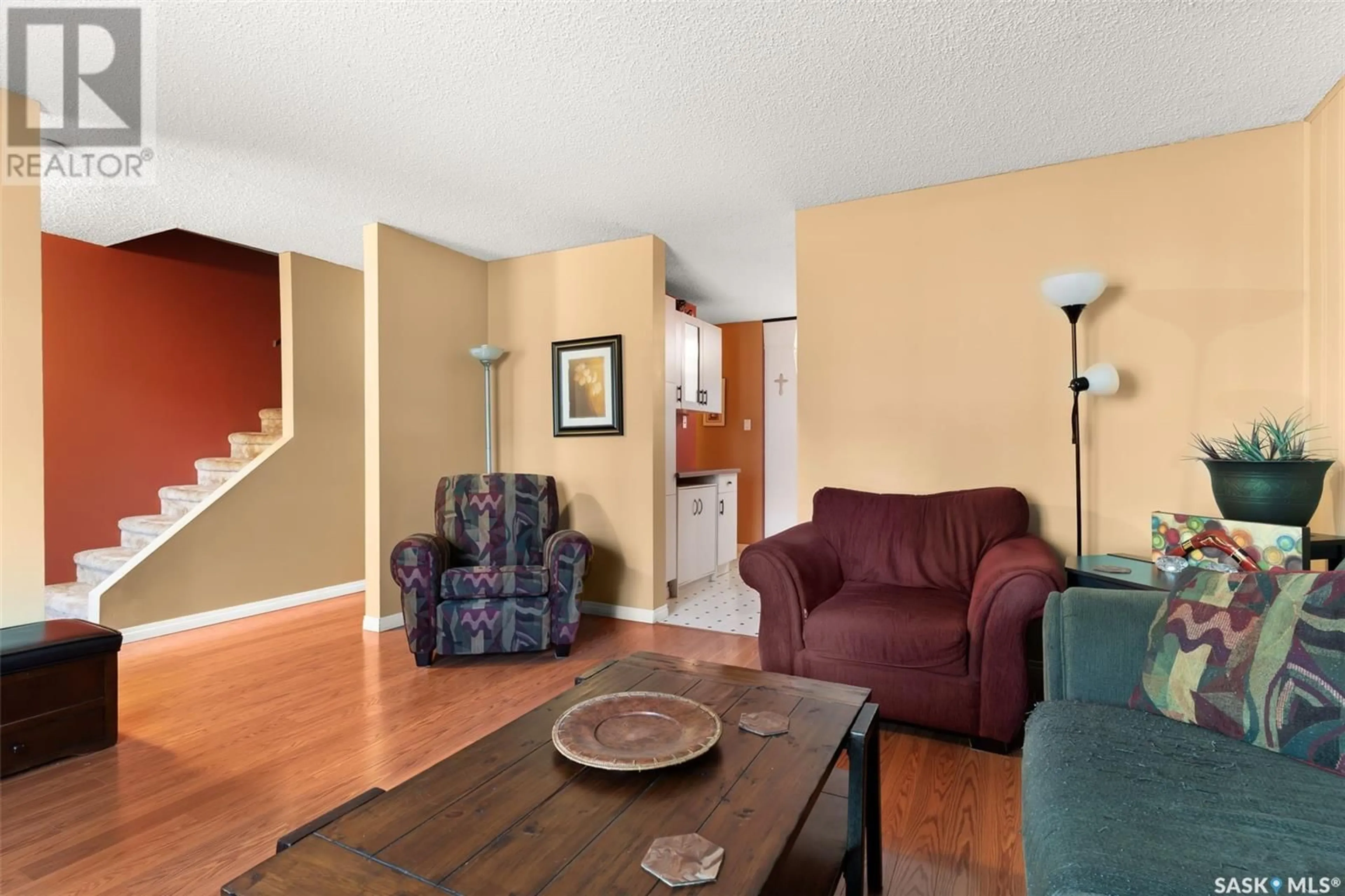Living room with furniture, wood/laminate floor for 45 SPRUCEVIEW ROAD, Regina Saskatchewan S4R0E1