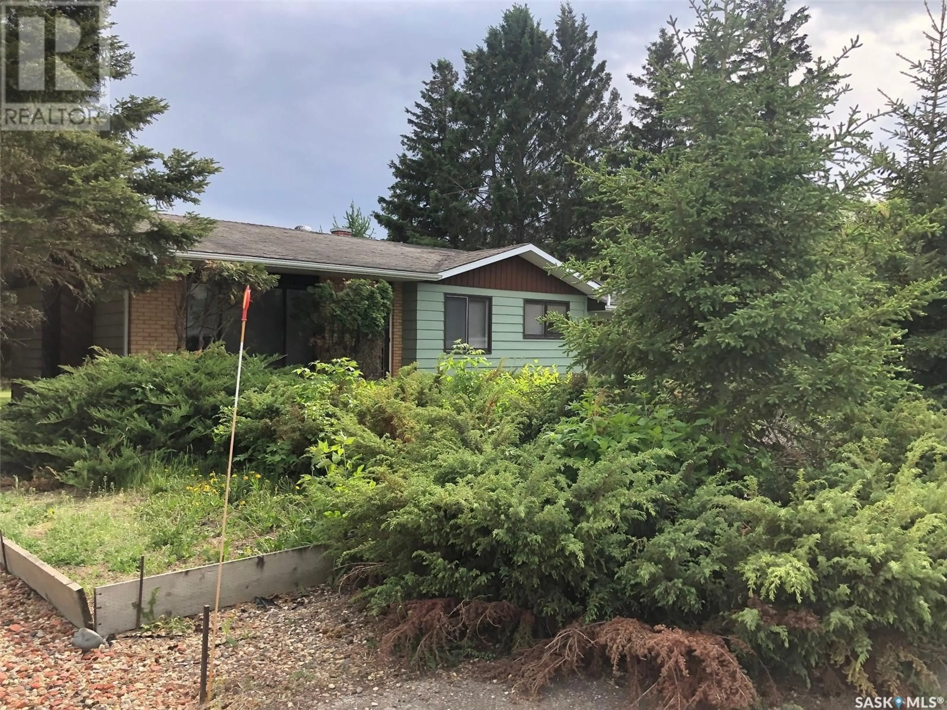 A pic from outside/outdoor area/front of a property/back of a property/a pic from drone, forest/trees view for E - 226 SASKATCHEWAN STREET, Kamsack Saskatchewan S0A1S0