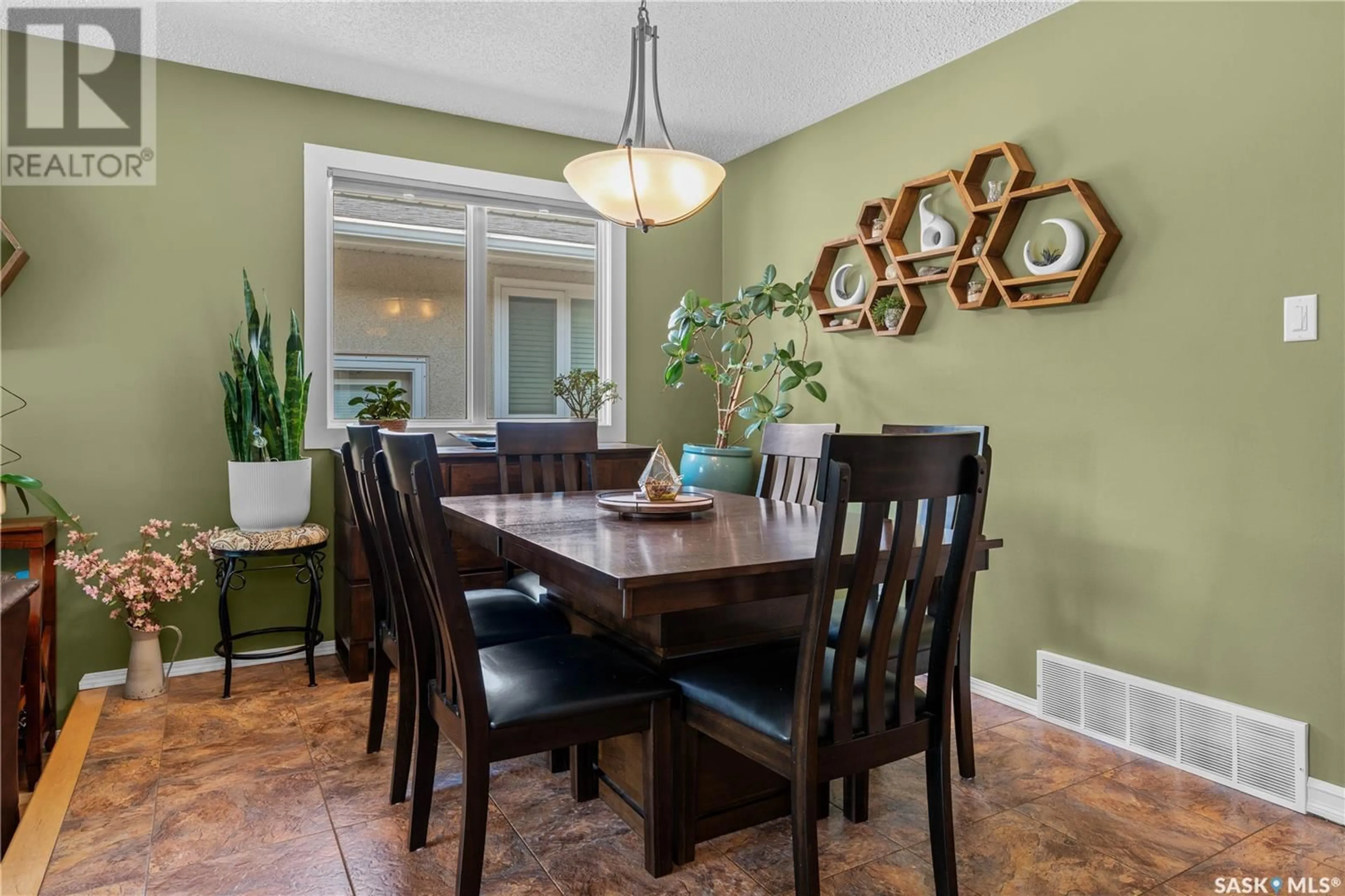 Dining room, wood/laminate floor for 15 WINDFIELD ROAD, Regina Saskatchewan S4V0E6
