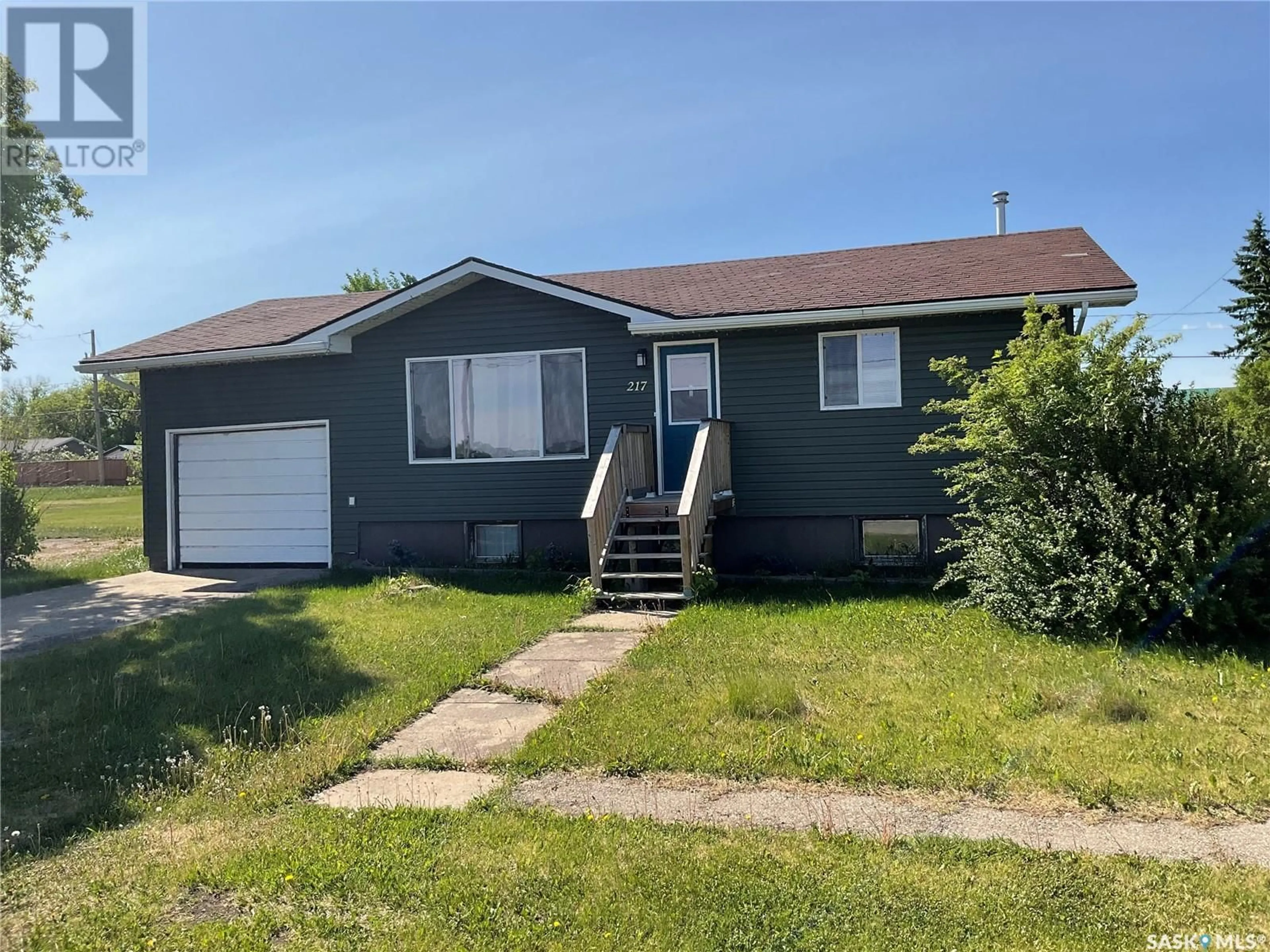 Home with vinyl exterior material, street for 217 3RD STREET, Wakaw Saskatchewan S0K4P0