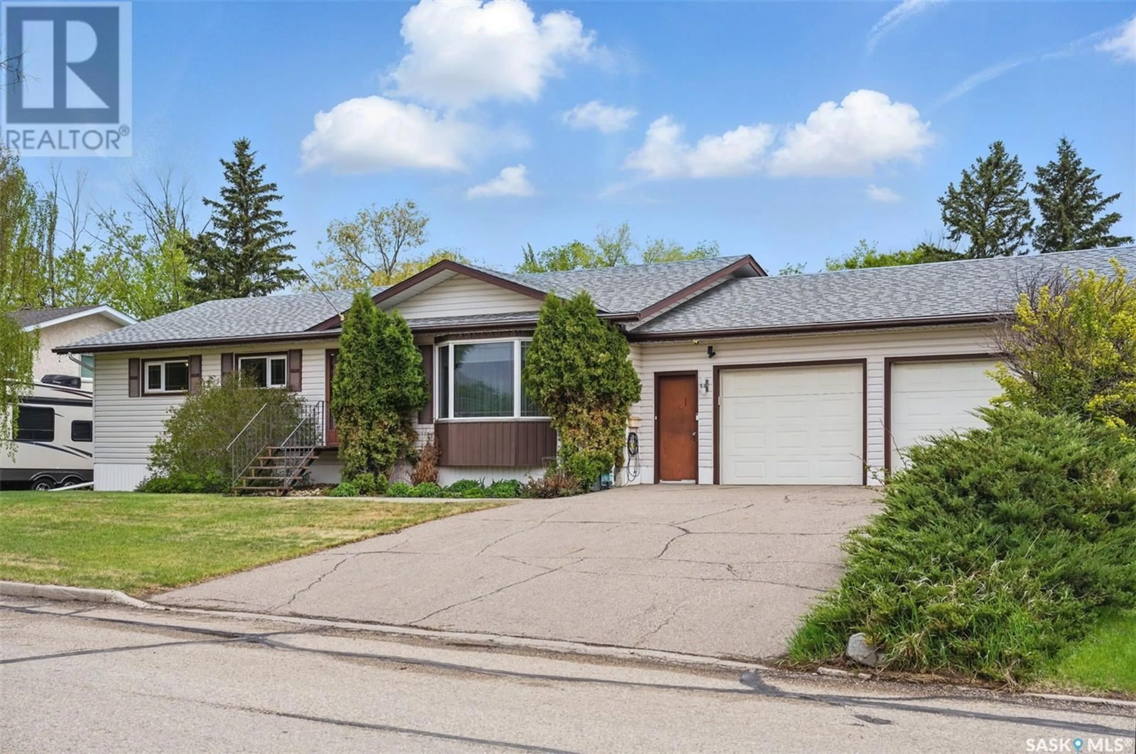 Home with vinyl exterior material, street for 210 7TH AVENUE, Watrous Saskatchewan S0K4T0