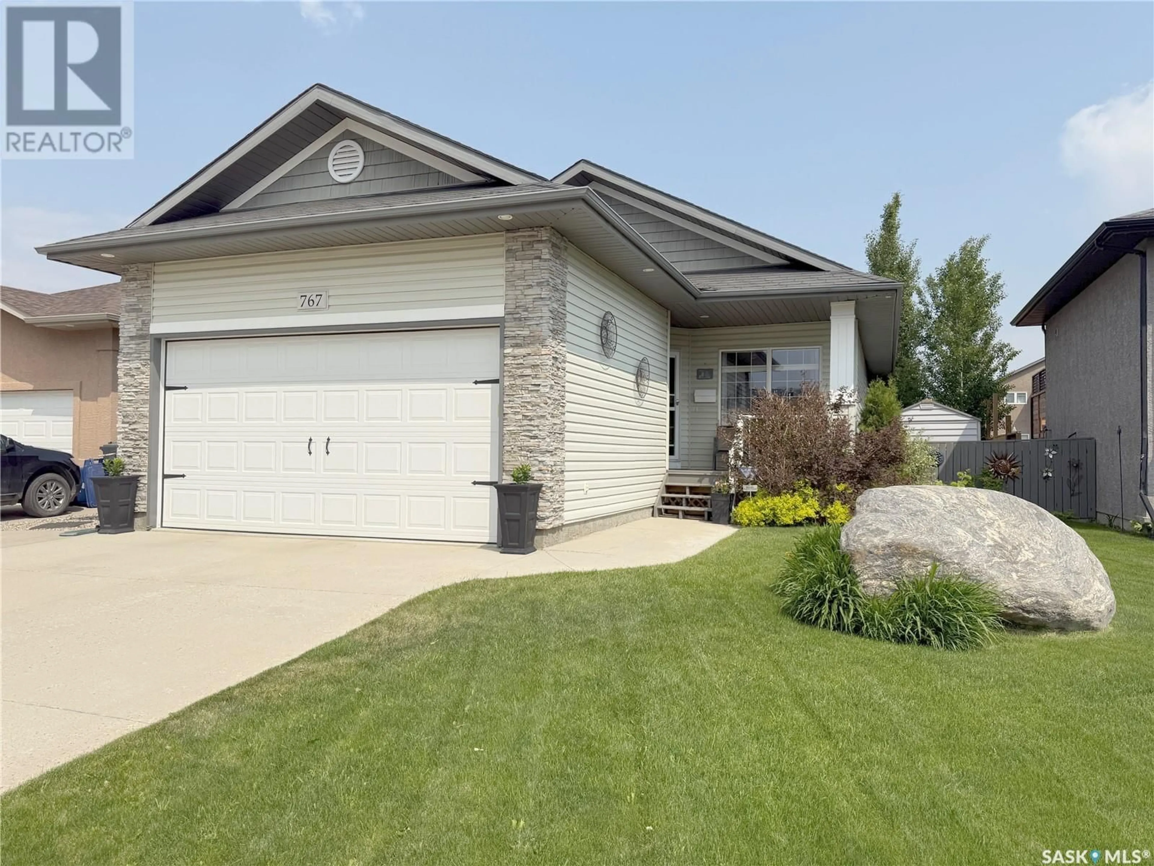 Home with vinyl exterior material, street for 767 SANDSTONE TERRACE, Martensville Saskatchewan S0K2T2