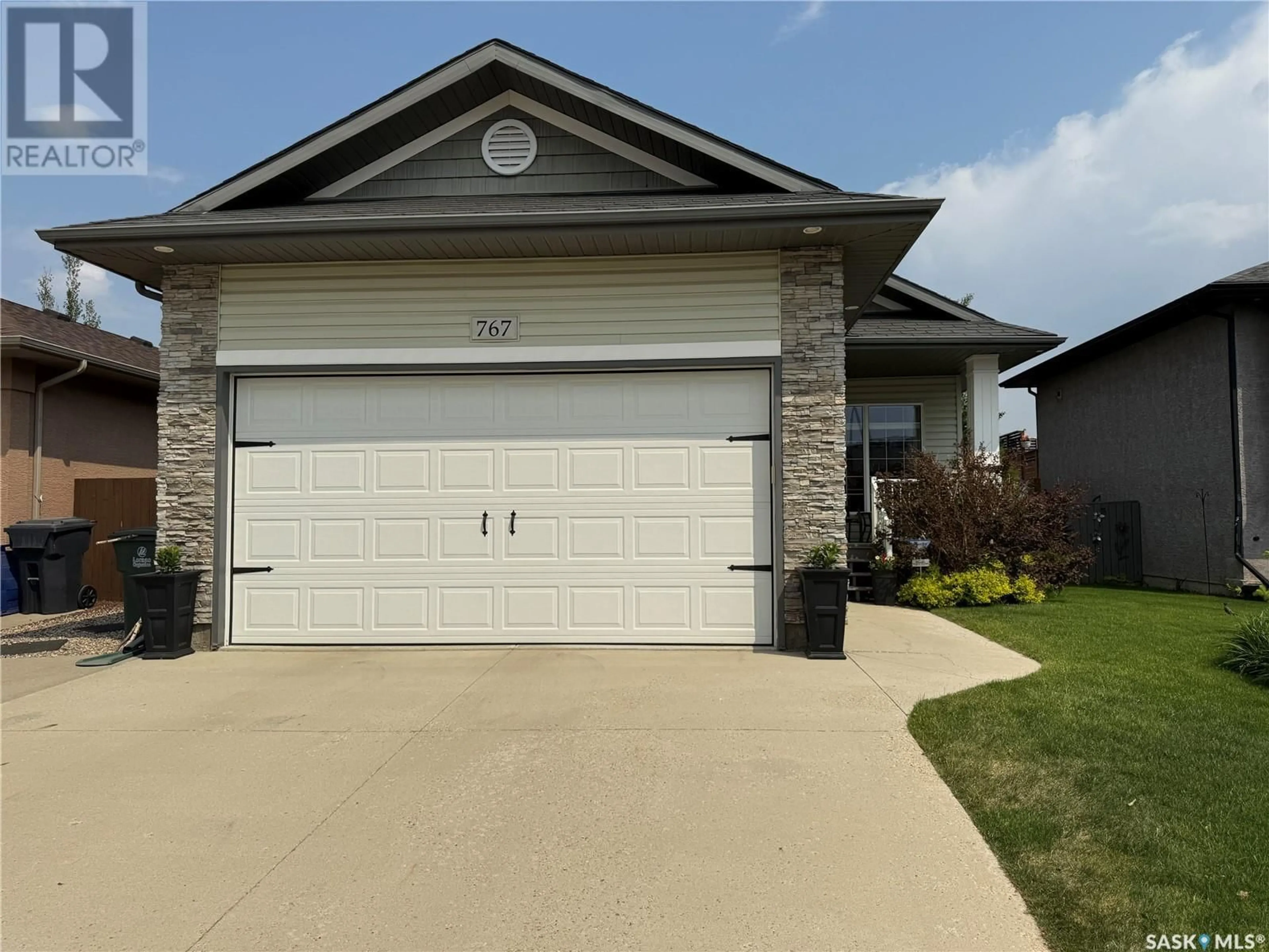 Home with vinyl exterior material, street for 767 SANDSTONE TERRACE, Martensville Saskatchewan S0K2T2