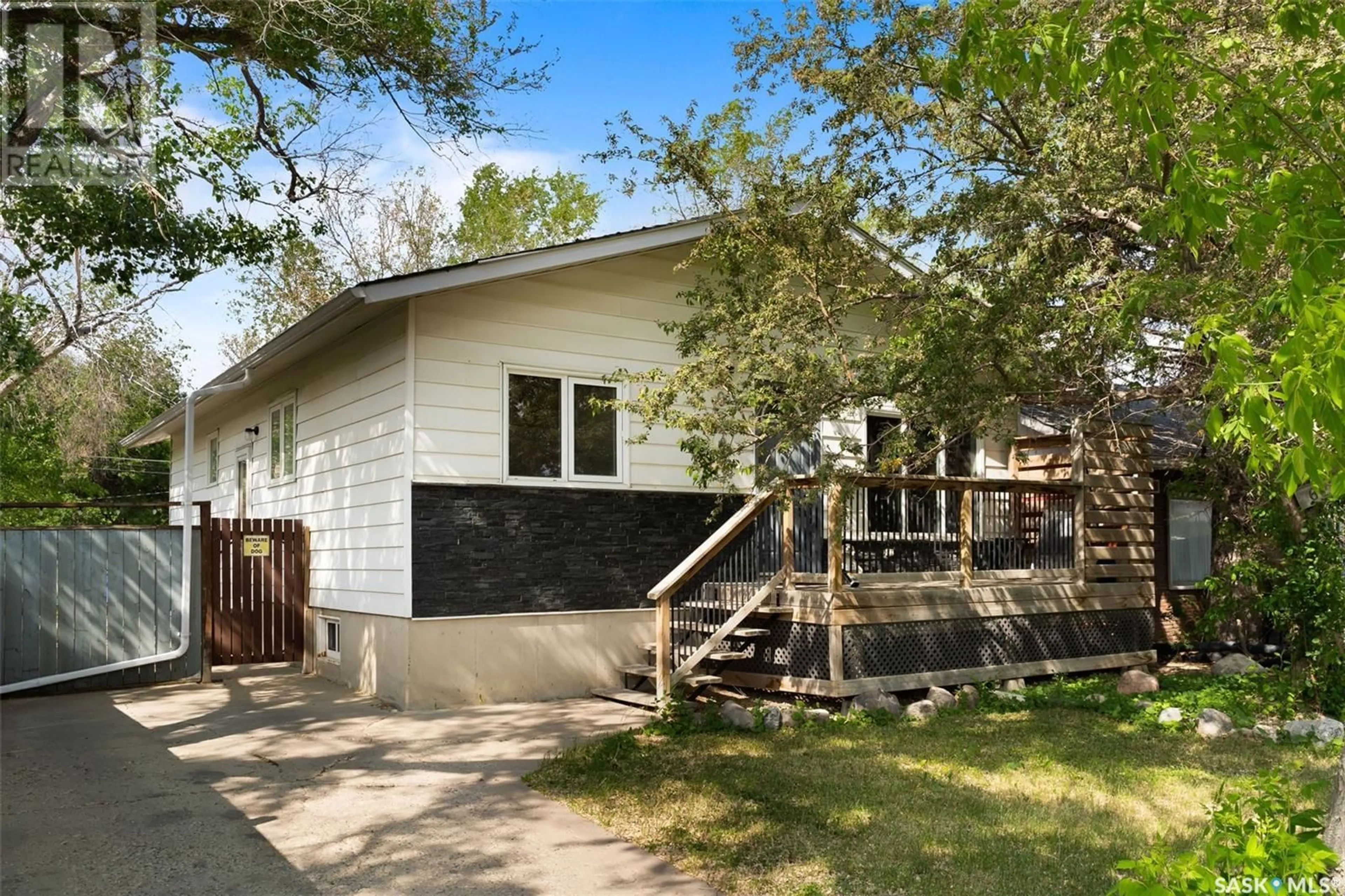Home with vinyl exterior material, street for 6234 DEWDNEY AVENUE, Regina Saskatchewan S4T1E2