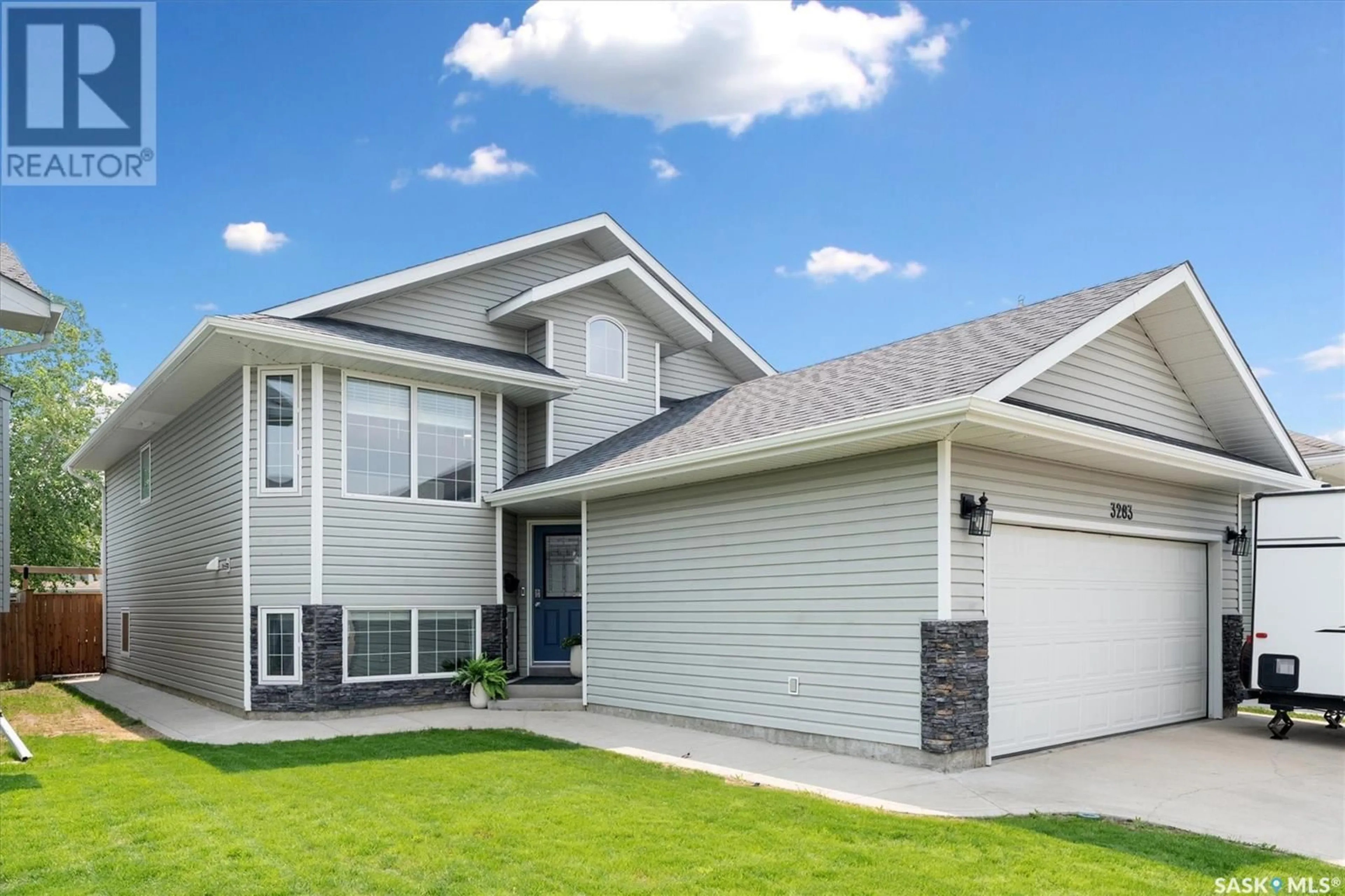 Home with vinyl exterior material, street for 3283 MCCLOCKLIN ROAD, Saskatoon Saskatchewan S7R0B9