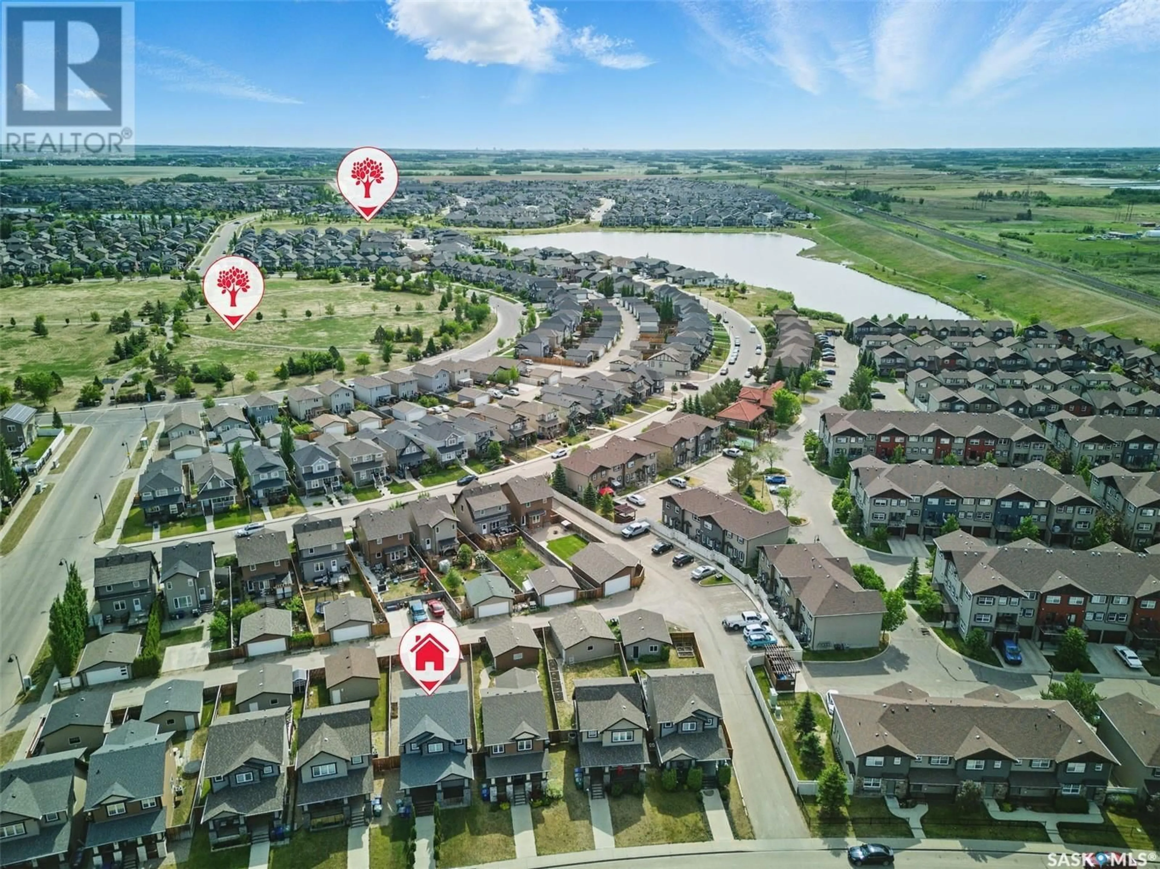 A pic from outside/outdoor area/front of a property/back of a property/a pic from drone, water/lake/river/ocean view for 370 LEVALLEY COVE, Saskatoon Saskatchewan S7T0H2