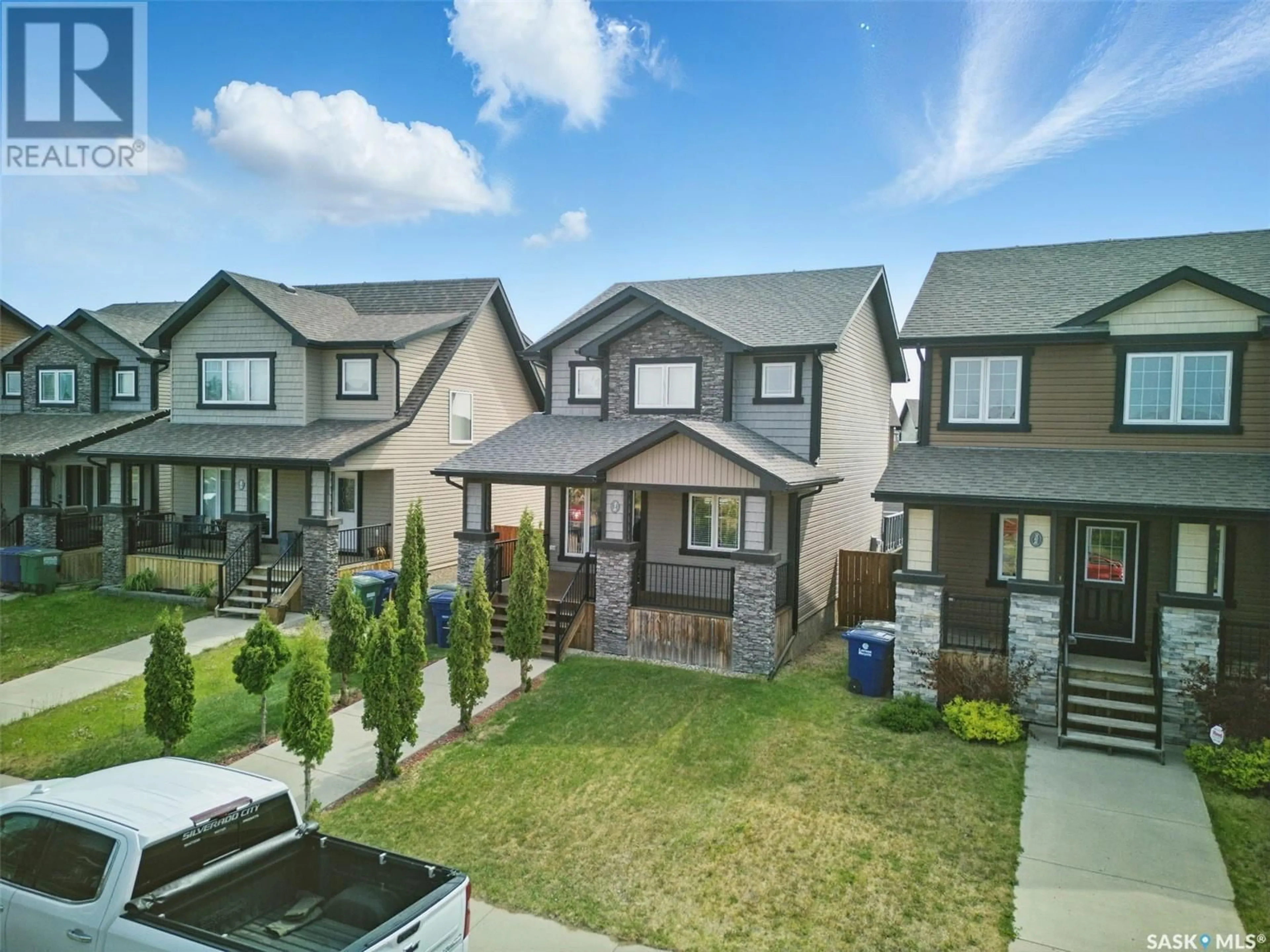 A pic from outside/outdoor area/front of a property/back of a property/a pic from drone, street for 370 LEVALLEY COVE, Saskatoon Saskatchewan S7T0H2